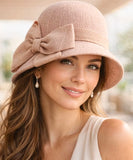Women's vintage cloche hat in blush pink with a side bow