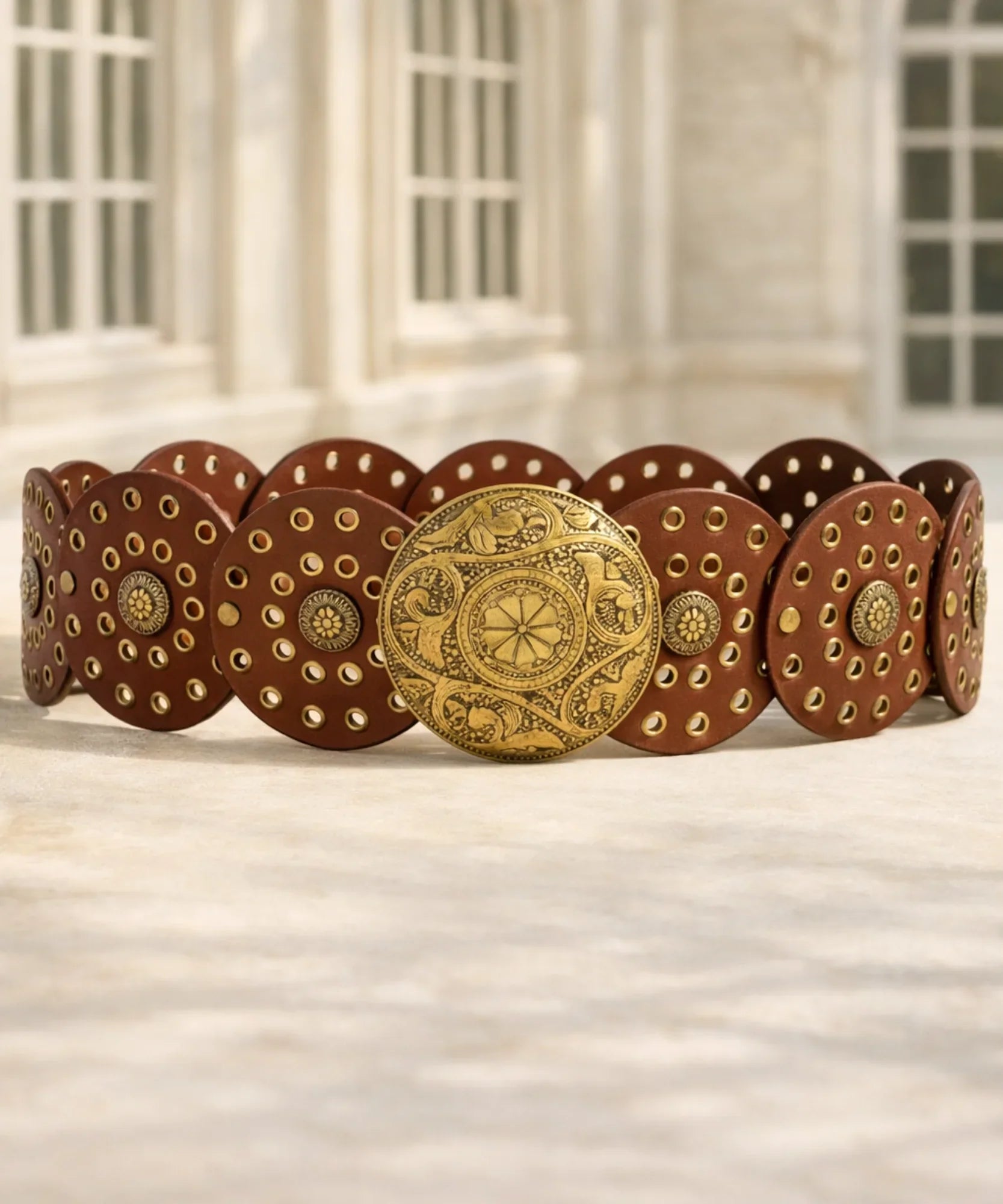 Women's brown concho belt with engraved gold buckle and studded medallions