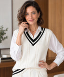 Women's ivory sweater vest with a black and white striped V-neck styled with a white shirt