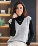 Women's cable knit V-neck sweater vest in grey, styled with a black turtleneck