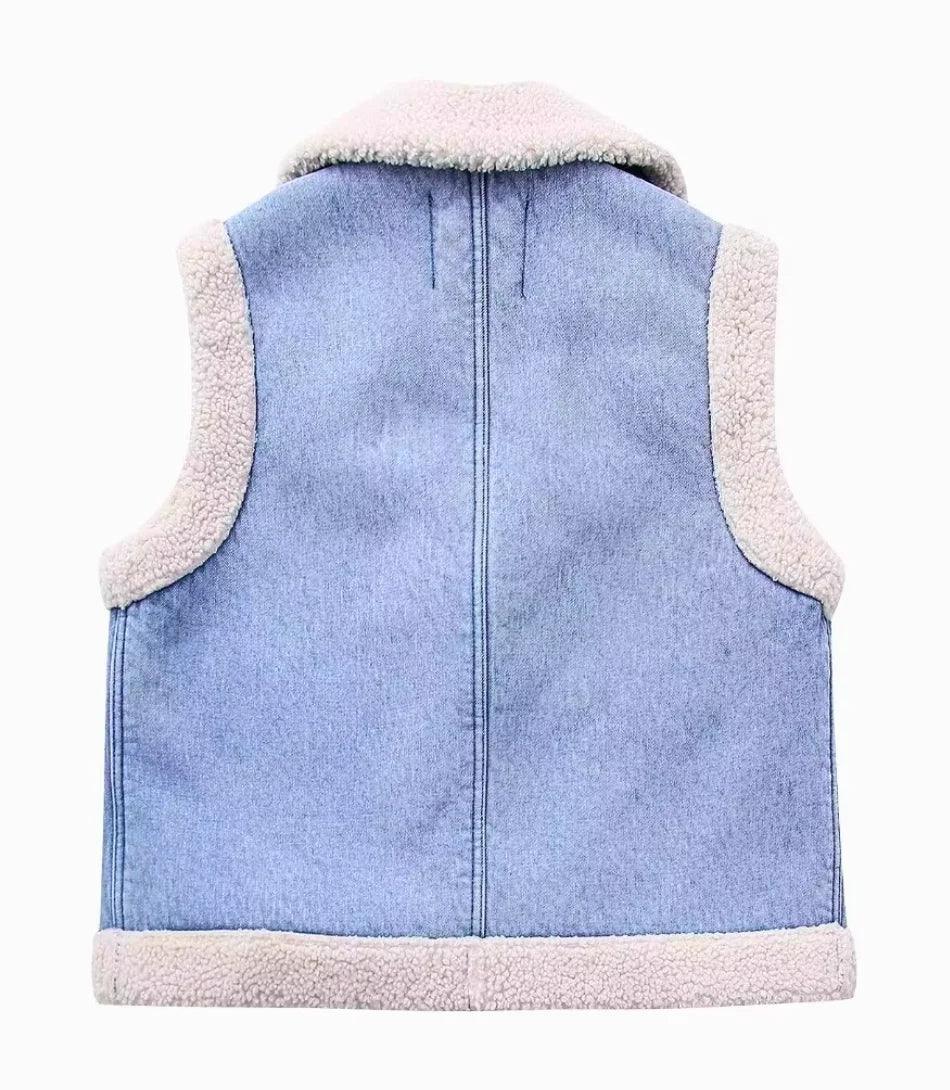 Women's sherpa-lined denim vest in blue, back view
