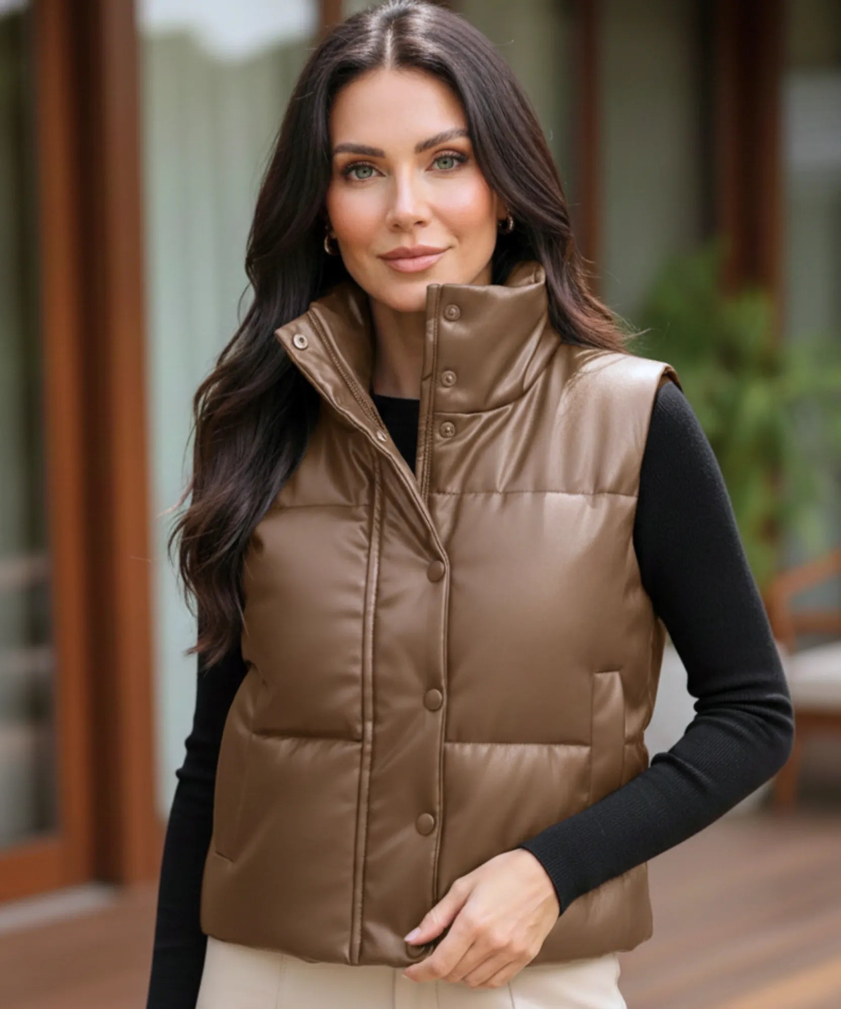 Women's leather puffer vest in brown, front view