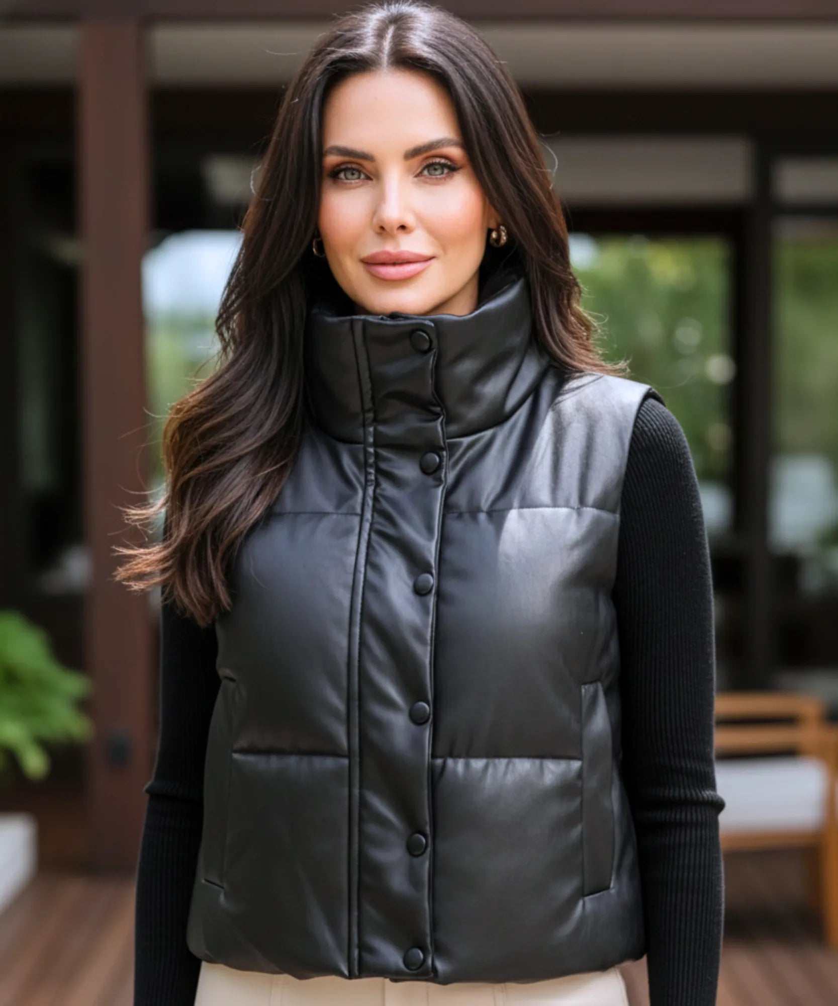 Women's leather puffer vest in black, styled look