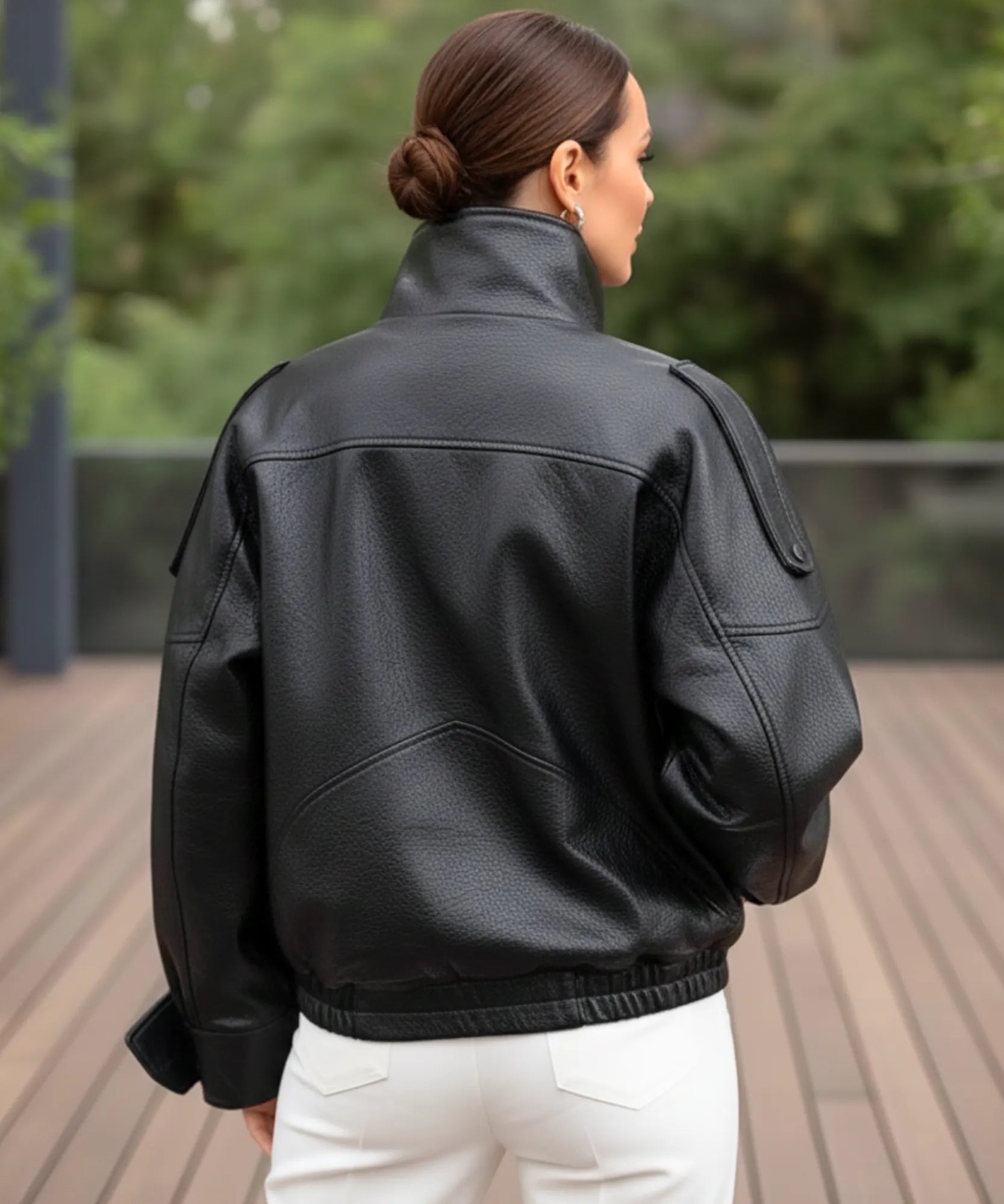 Woman posing in the oversized black leather jacket