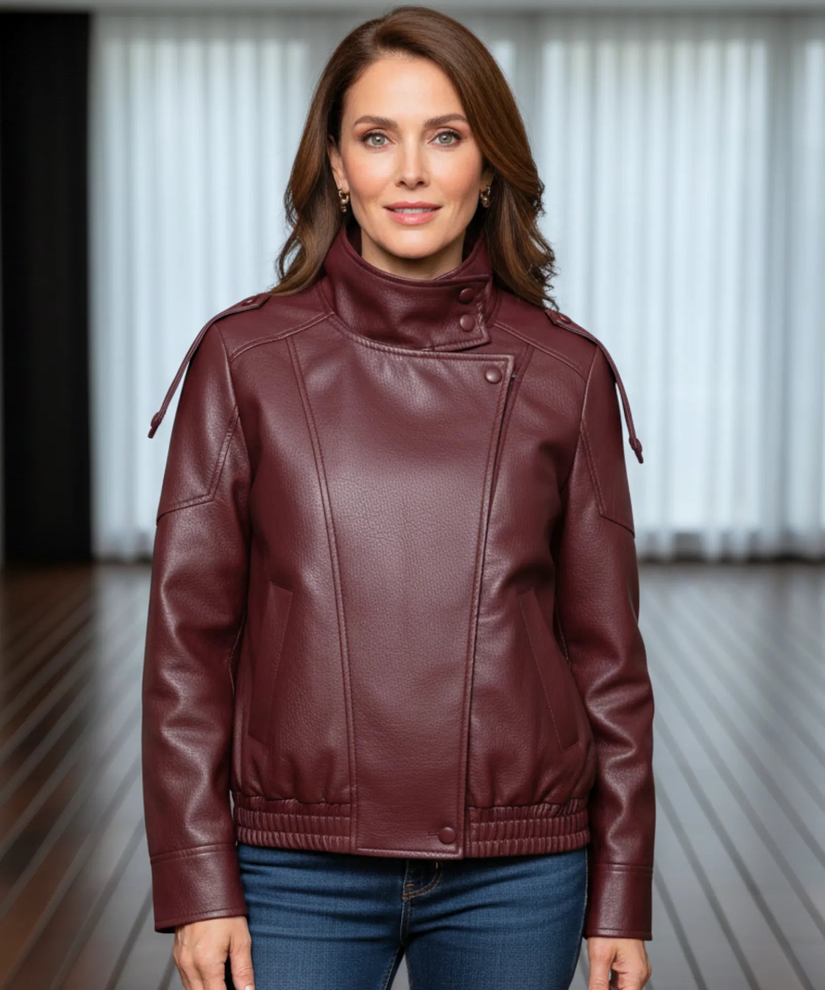 Woman styling the burgundy leather jacket with boots