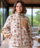 Woman wearing an oversized floral fleece jacket in ivory