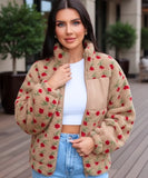 Close-up of the floral print on the camel fleece jacket