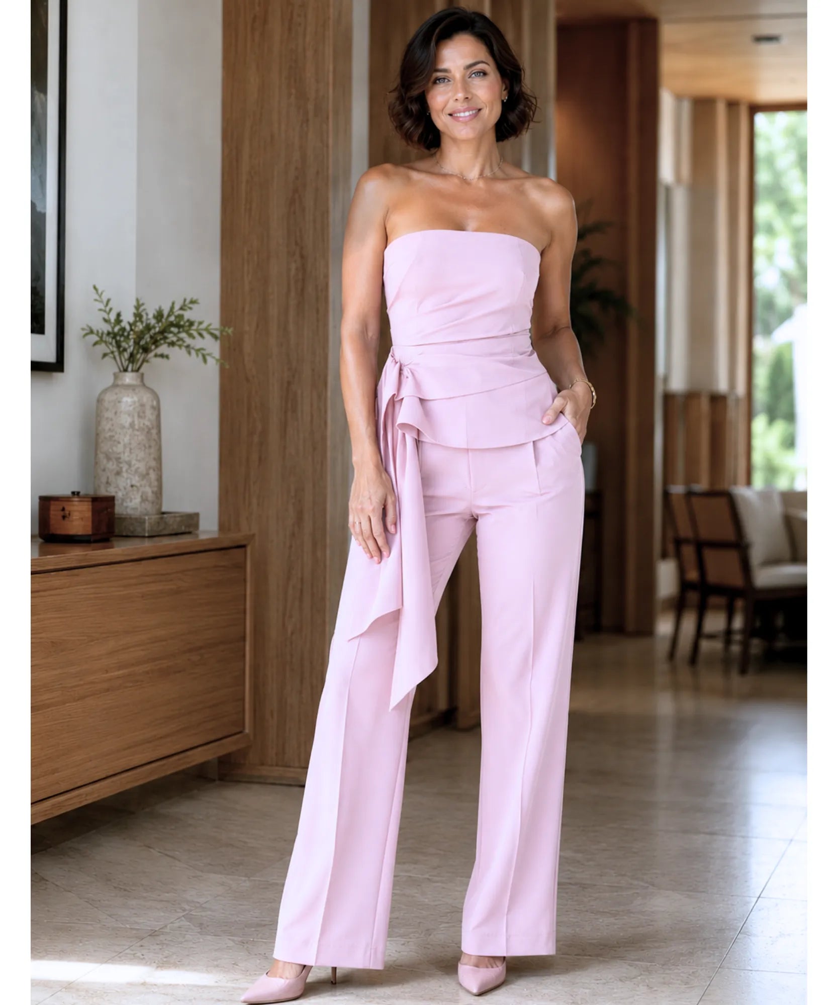 Women's tailored halter top and pants set in pink, close-up of the side tie