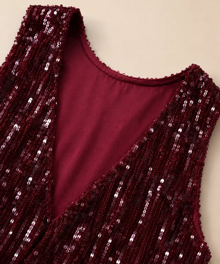 Close-up of the sequin fabric on the burgundy crop top and pants set