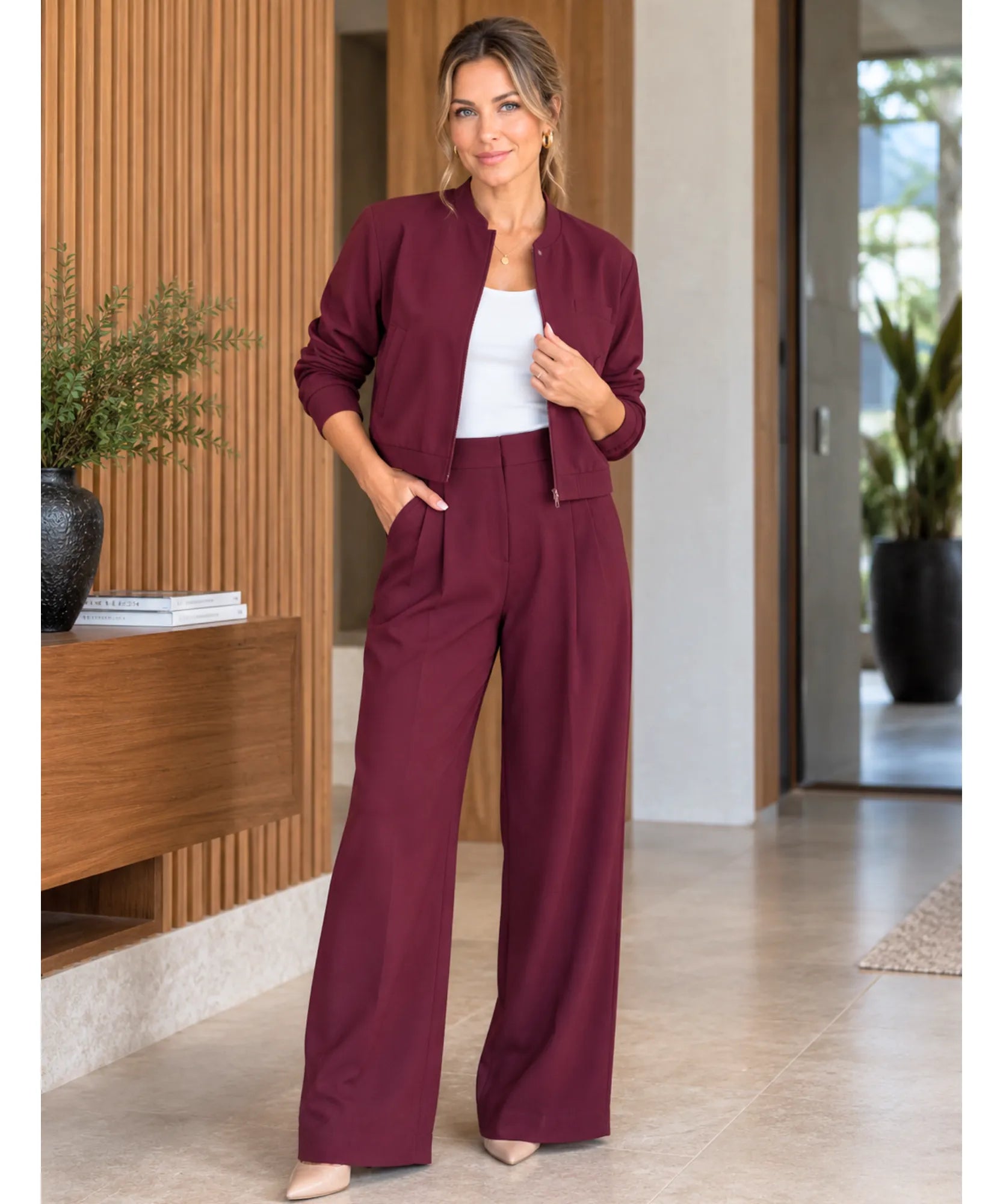 Women's burgundy blazer worn open over a white tank