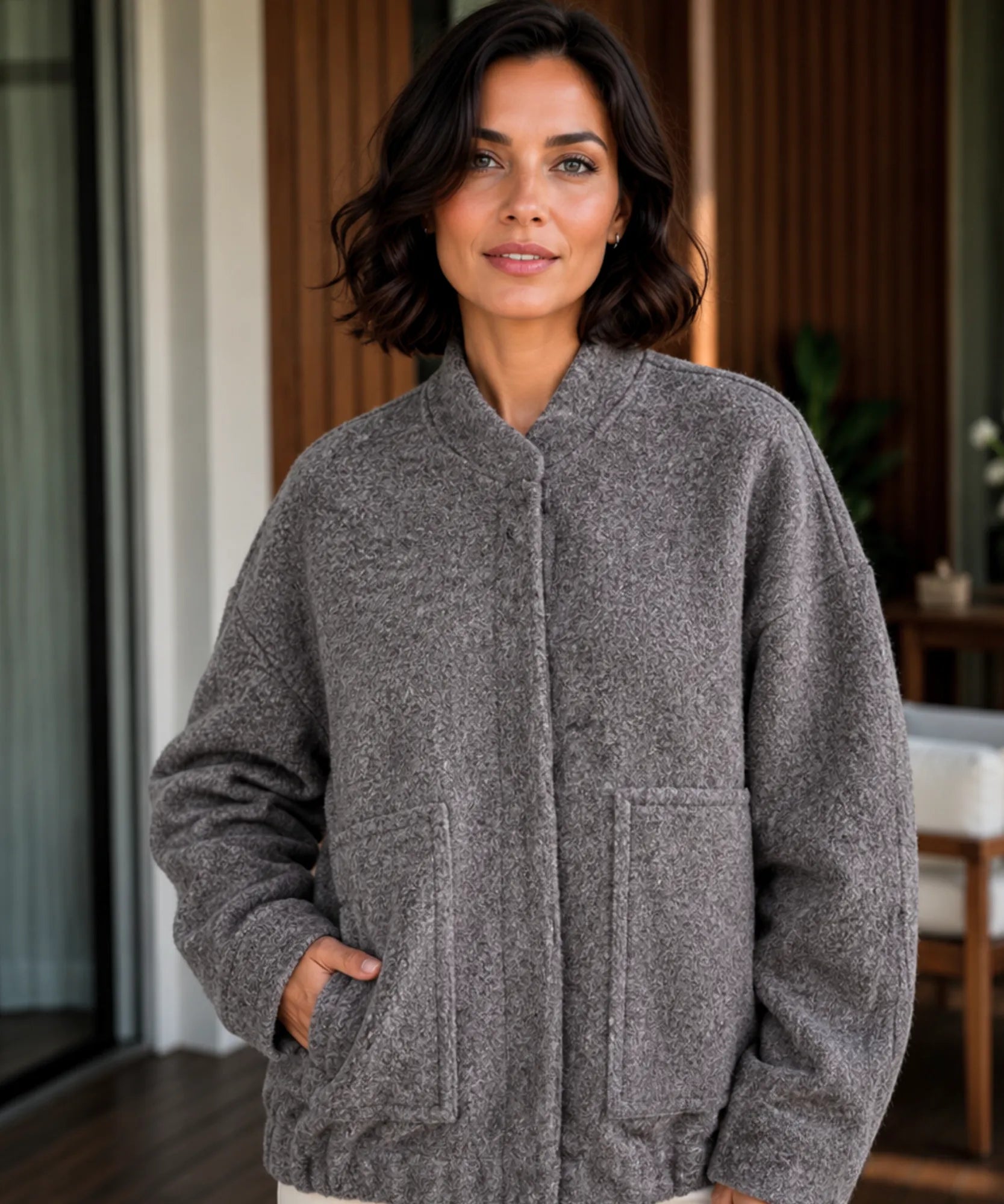 Close-up of the grey boucle bomber jacket texture