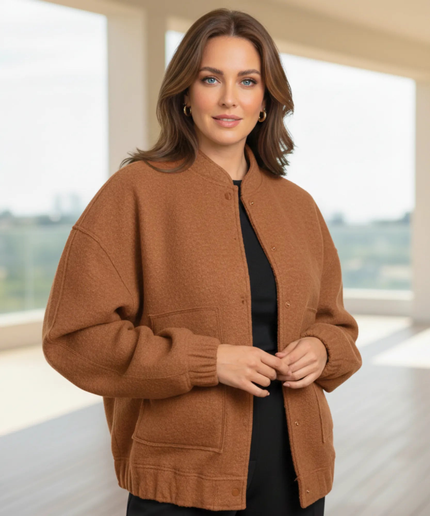 Back view of the oversized boucle bomber jacket in camel