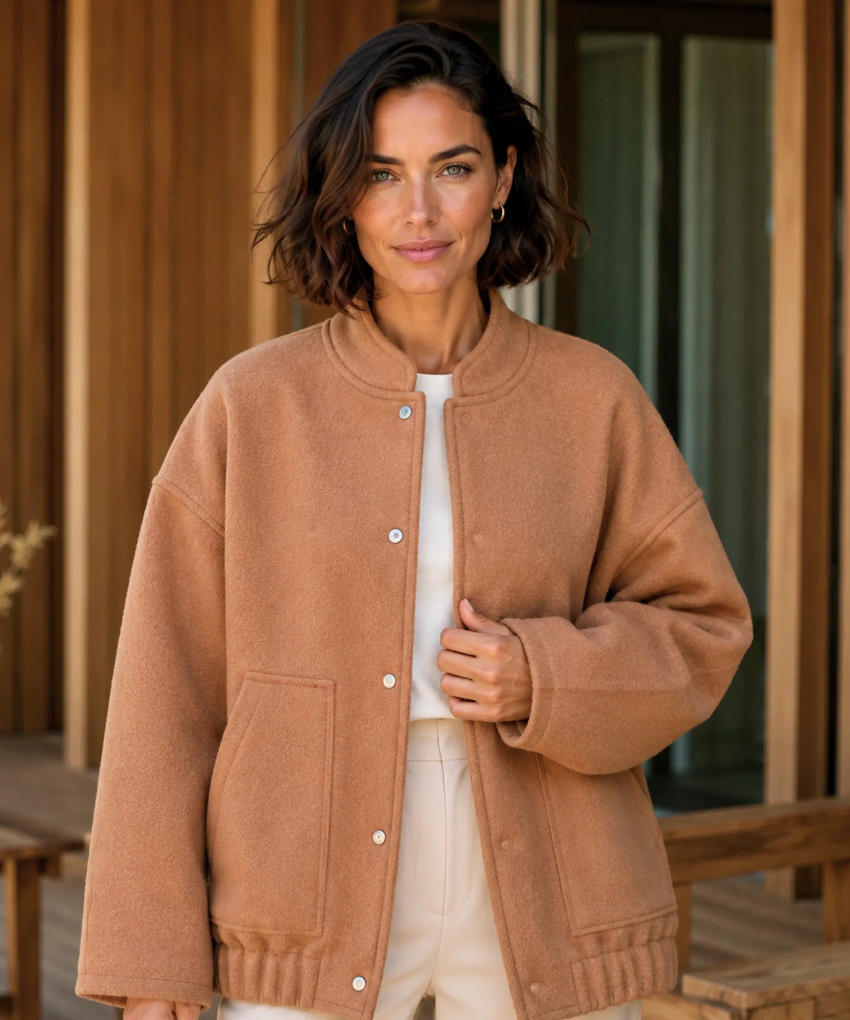 Front view of the oversized boucle bomber jacket in camel