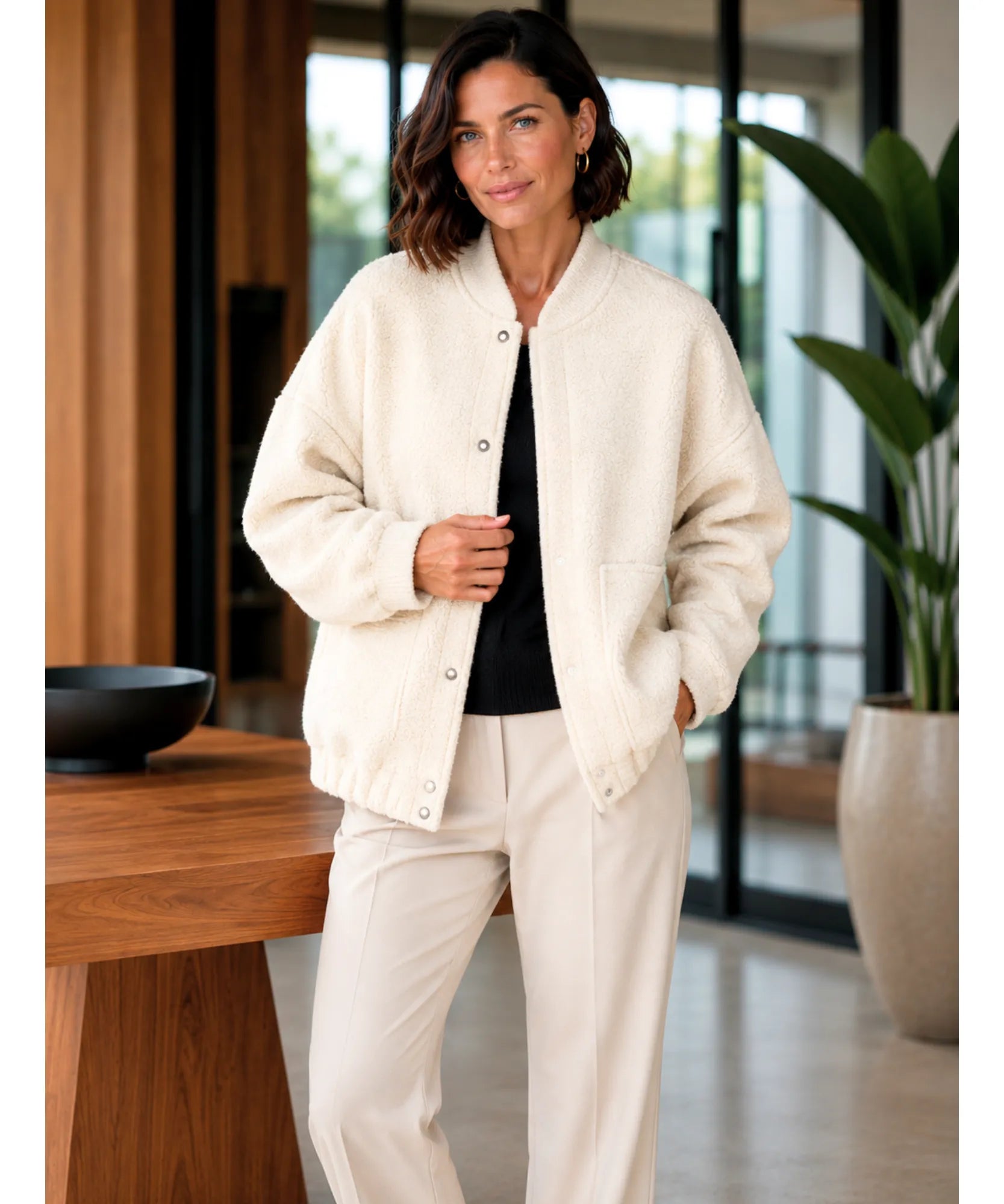 Front view of the oversized boucle bomber jacket in off white