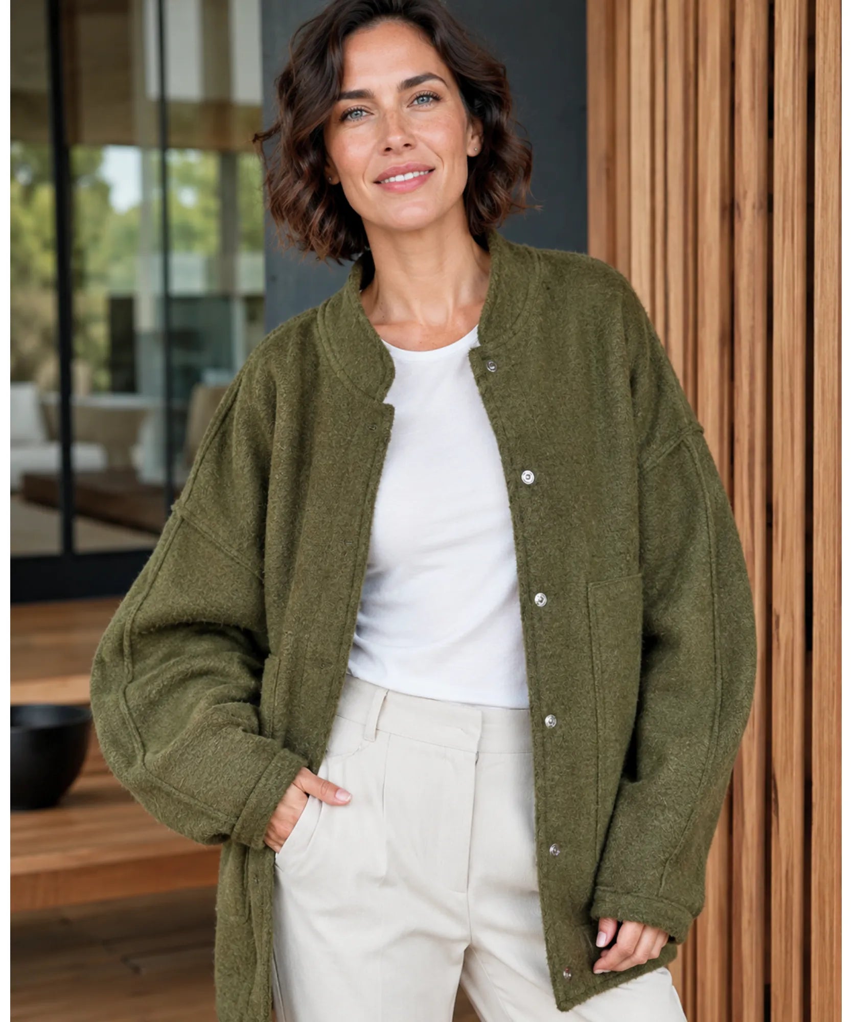 Back view of the oversized boucle bomber jacket in olive green