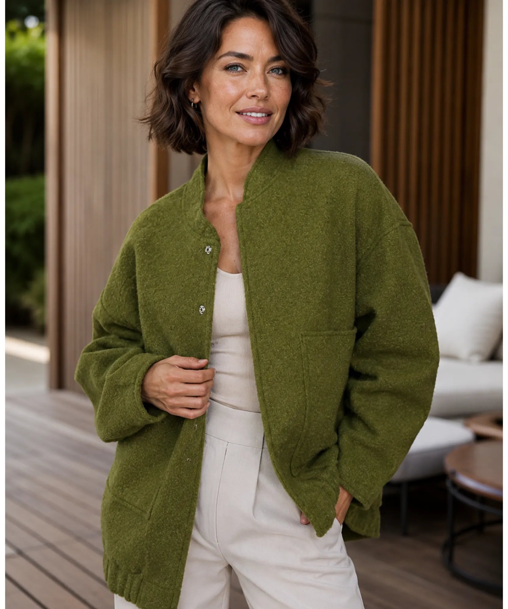 Front view of the oversized boucle bomber jacket in olive green