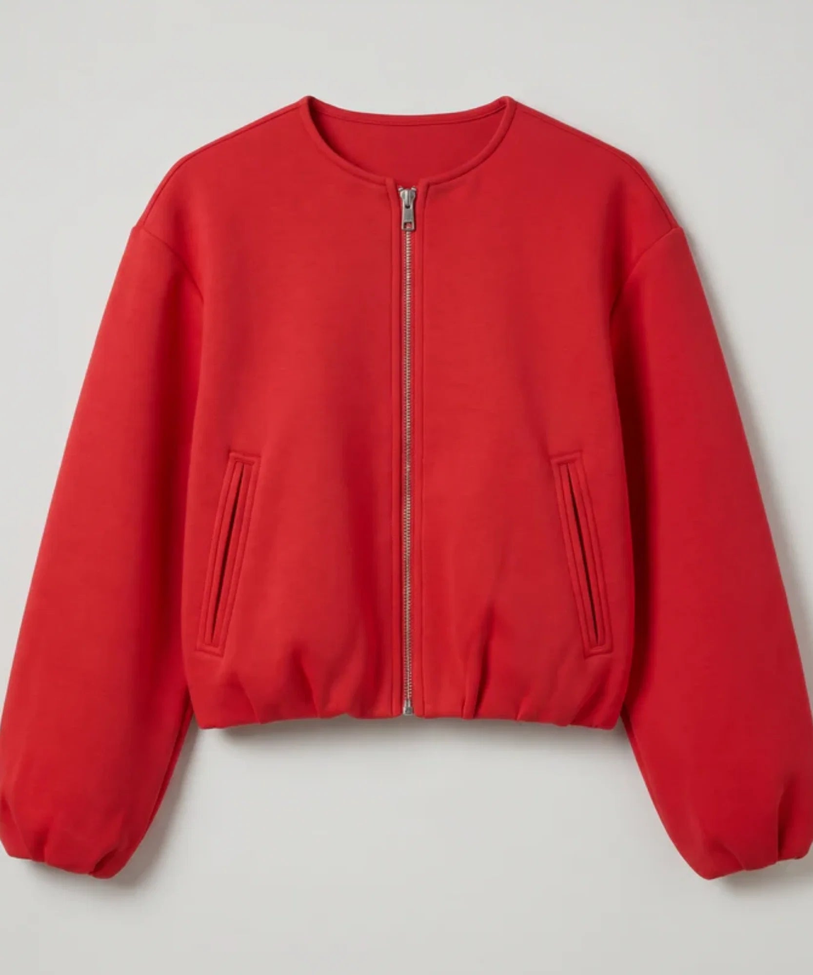 Close-up of the red wool bomber jacket and balloon sleeve