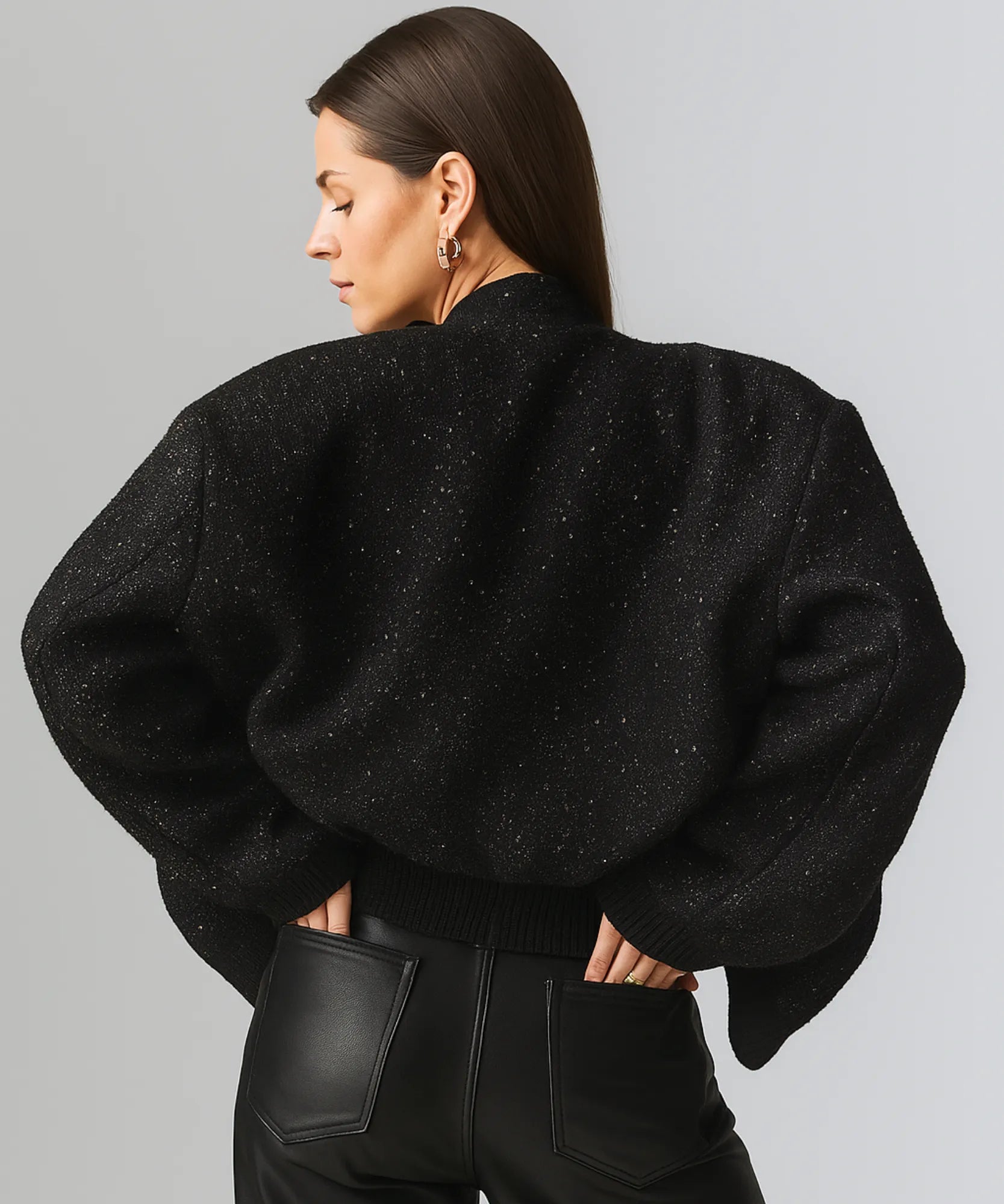 Women's black sequin bomber jacket, close-up of sequin detail