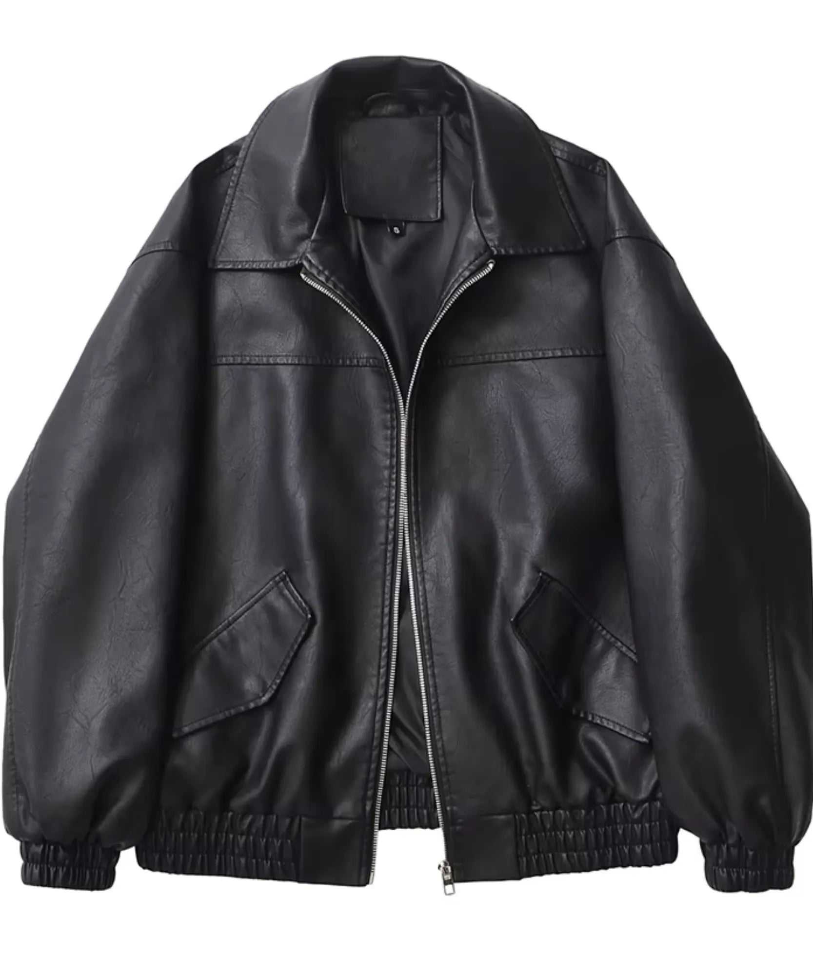 Women's boxy oversized leather jacket in black, close-up texture