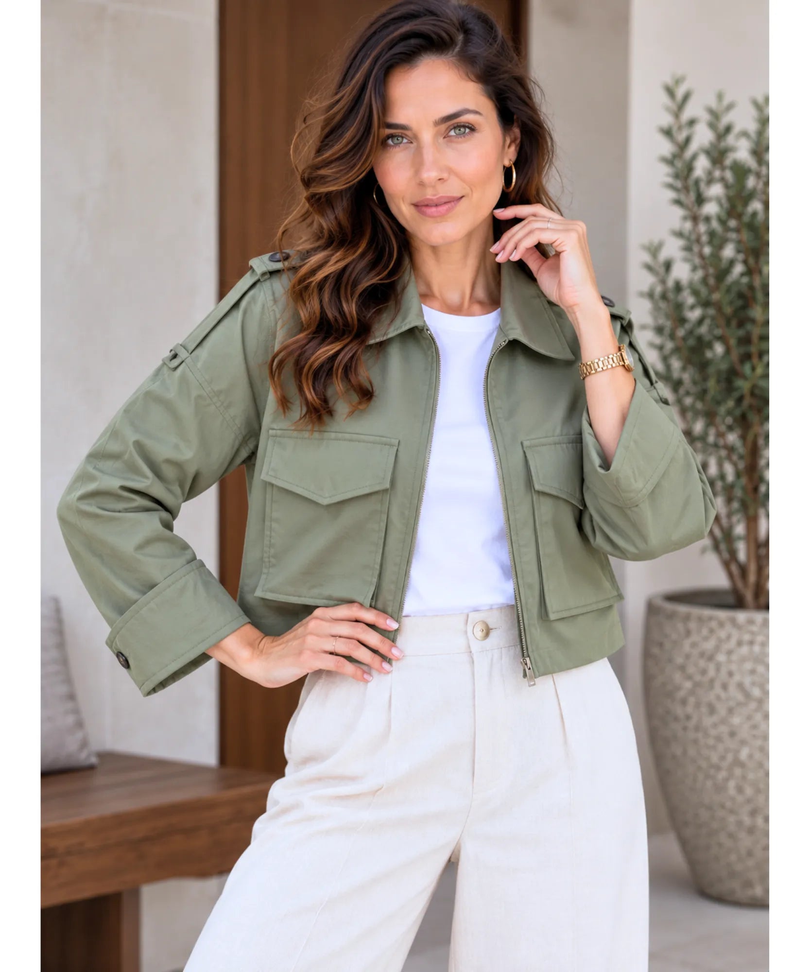 Women's cropped utility jacket in sage green worn open over a white tee