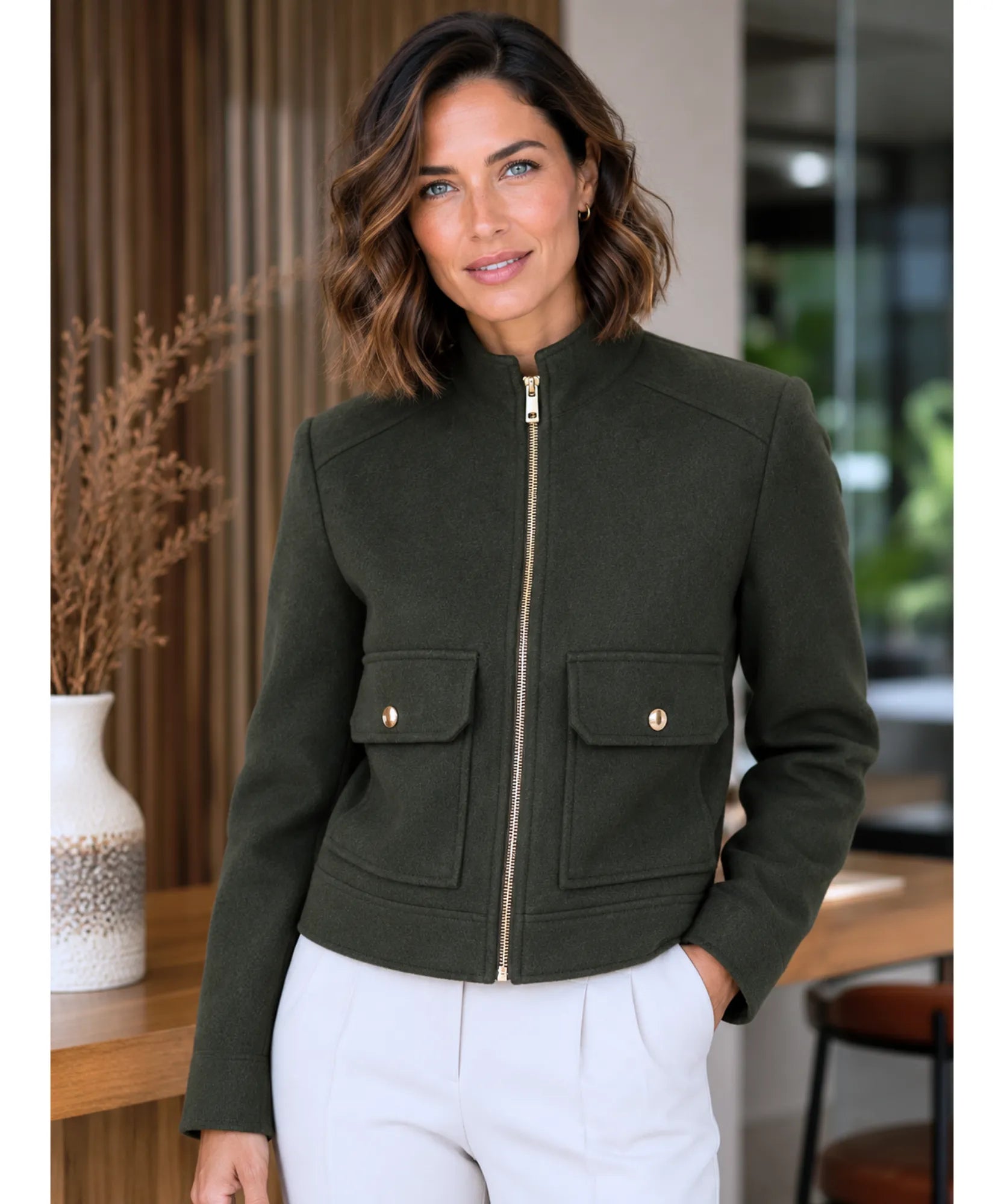 Close-up of the structured collar on the olive green wool jacket