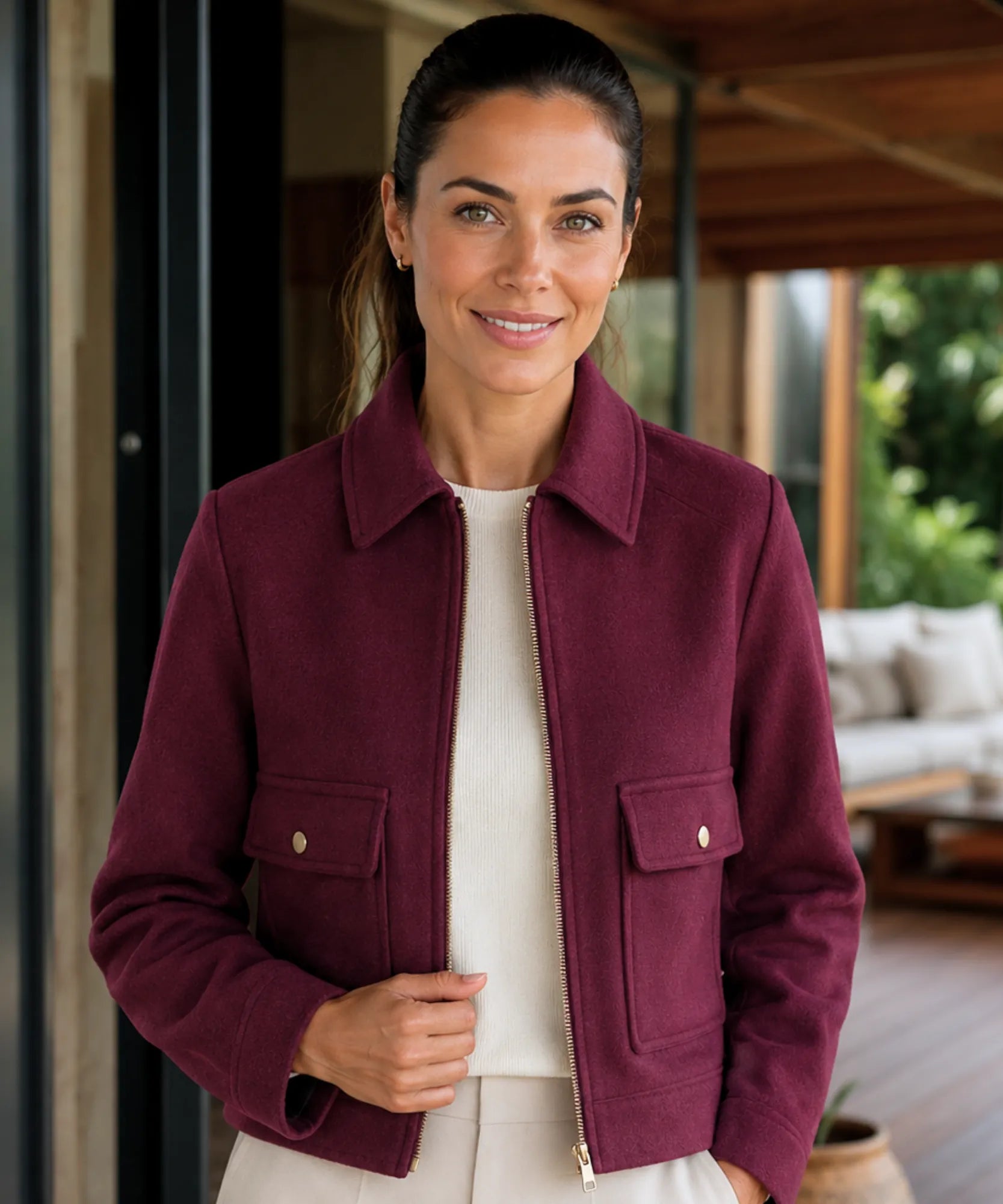 Women's wool jacket with gold zipper and structured collar in burgundy