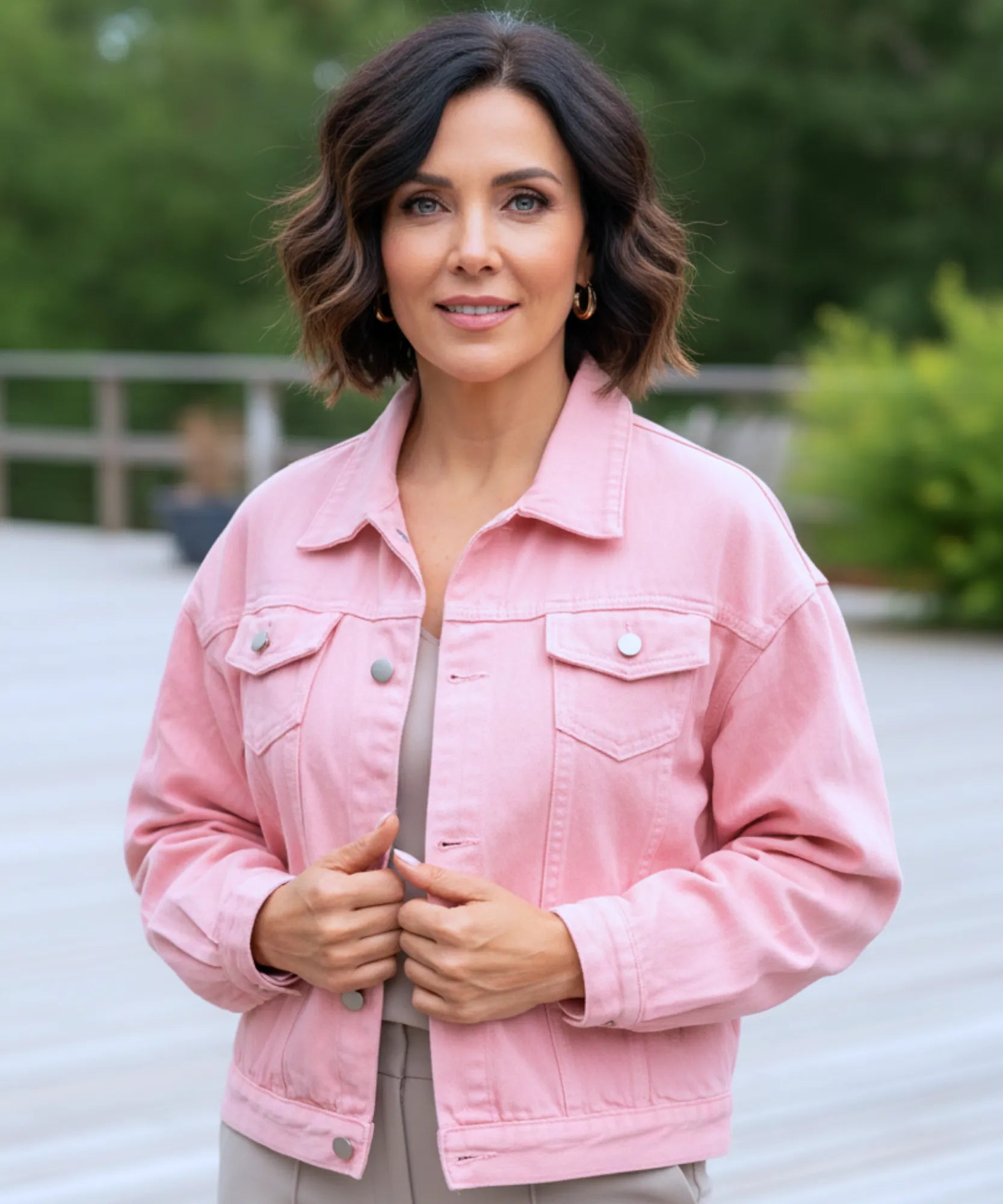 Women's pink oversized denim jacket, close-up of pocket detail