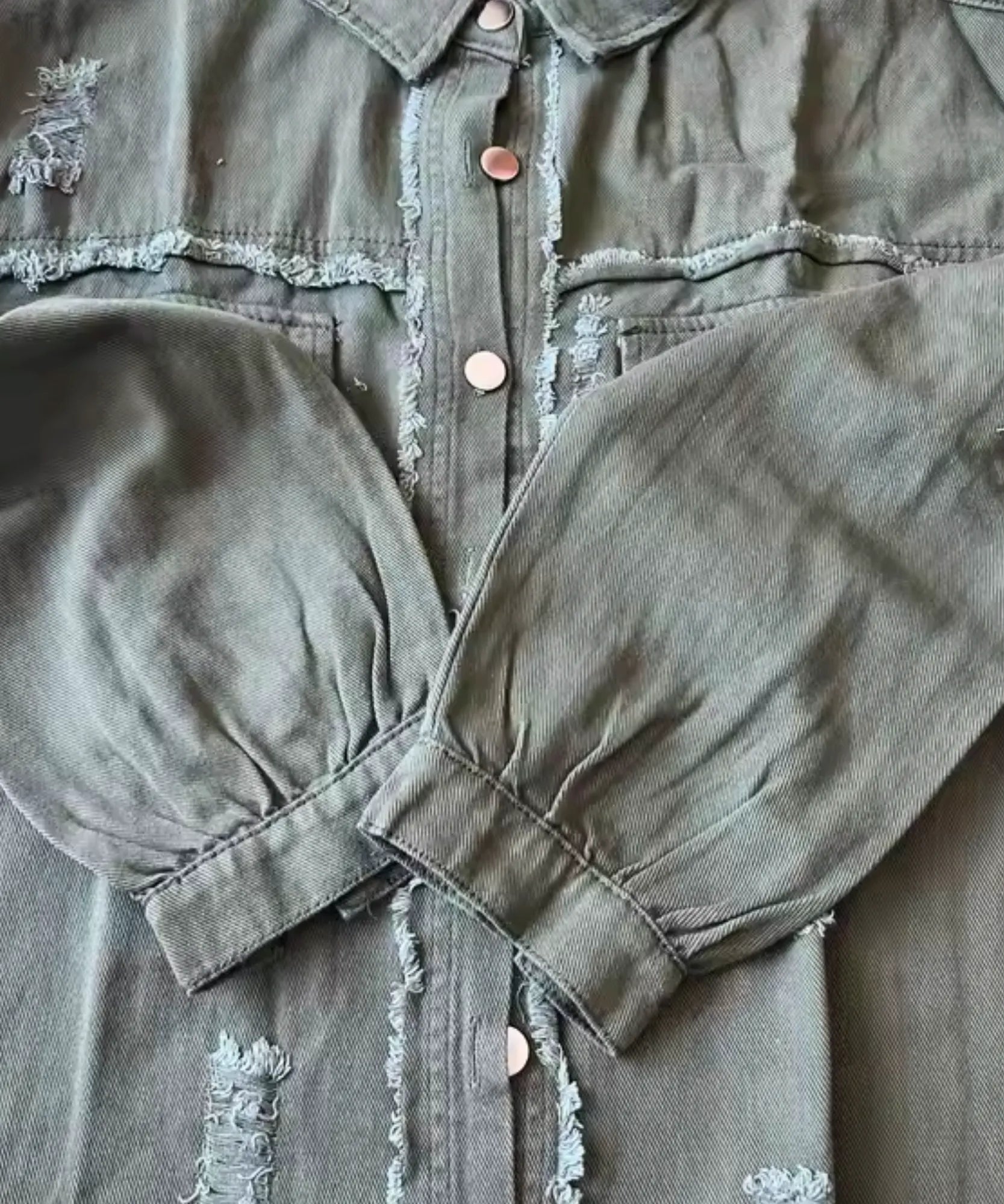 Women's grey distressed oversized denim jacket, back view
