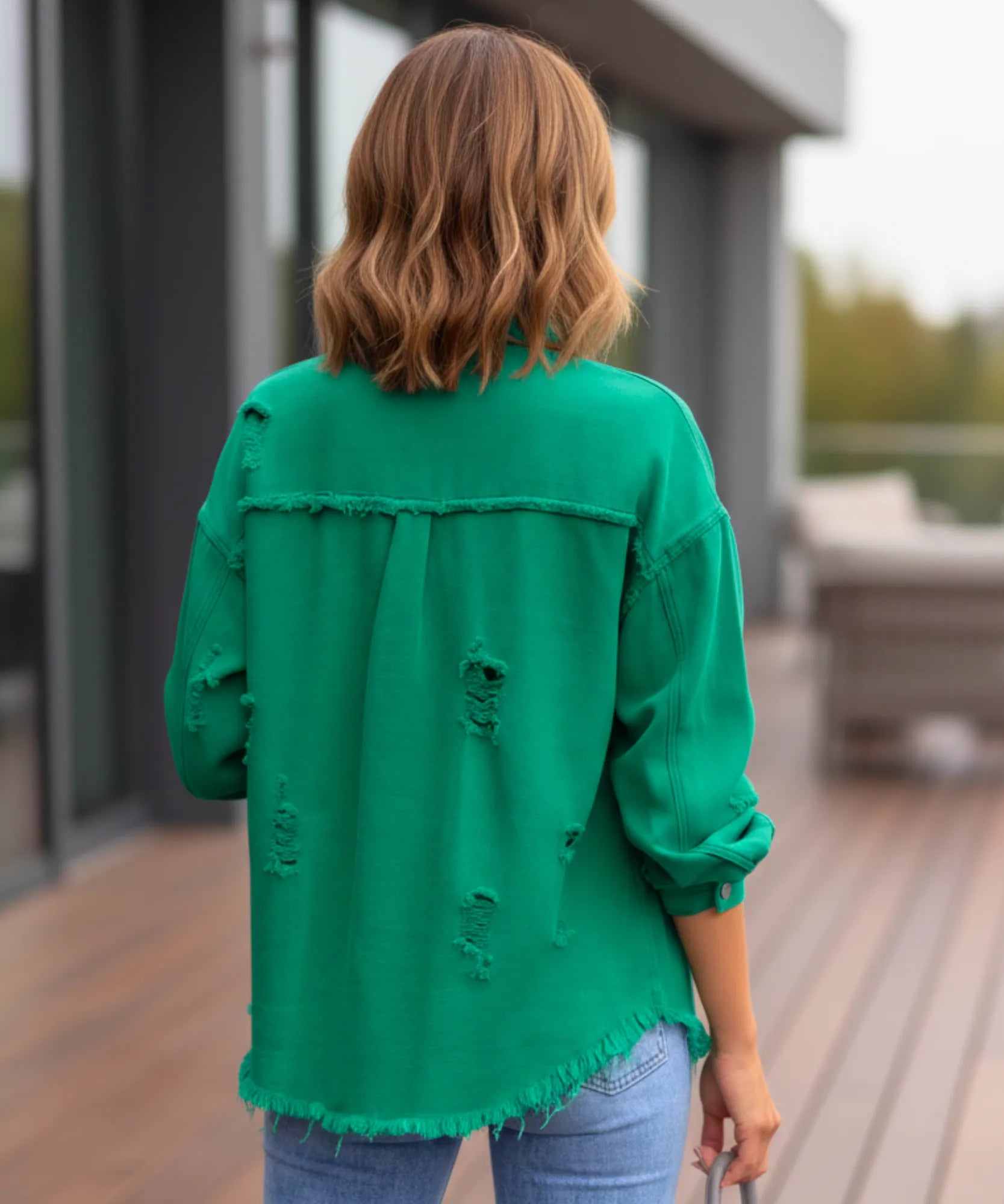 Women's green distressed oversized denim jacket, front view