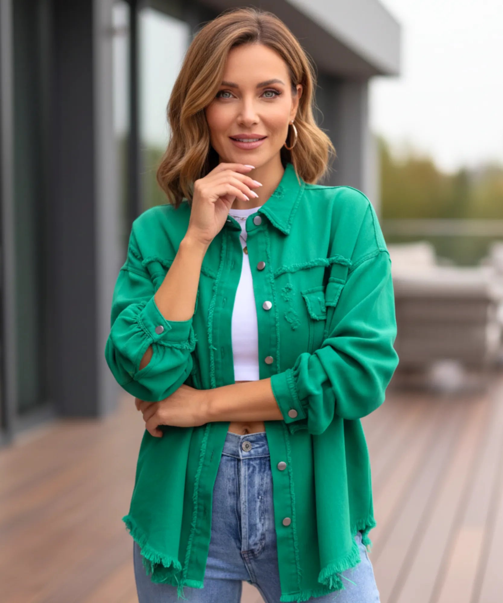 Women's green distressed oversized denim jacket, back view