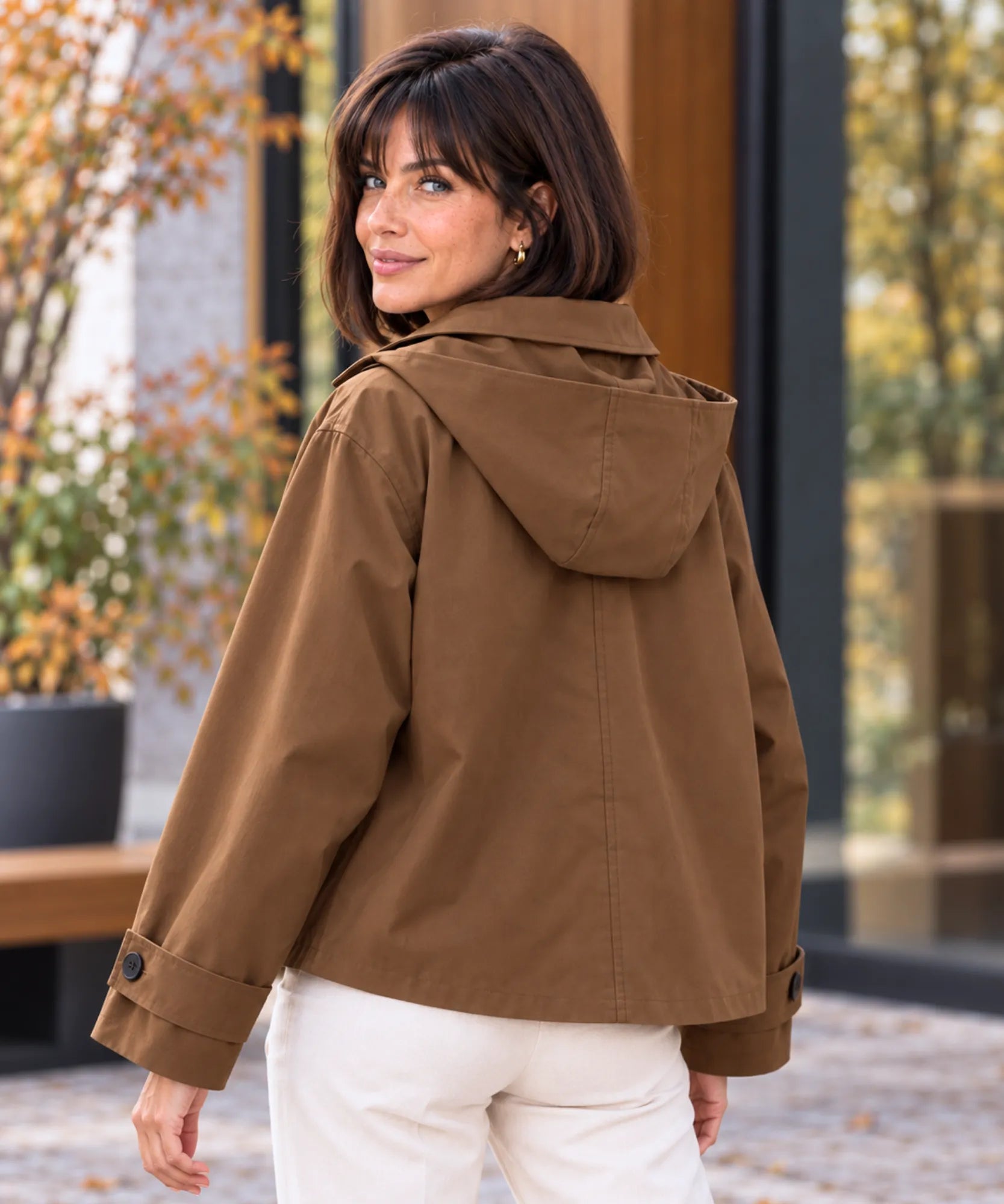 Women's utility jacket in brown, back view with hood