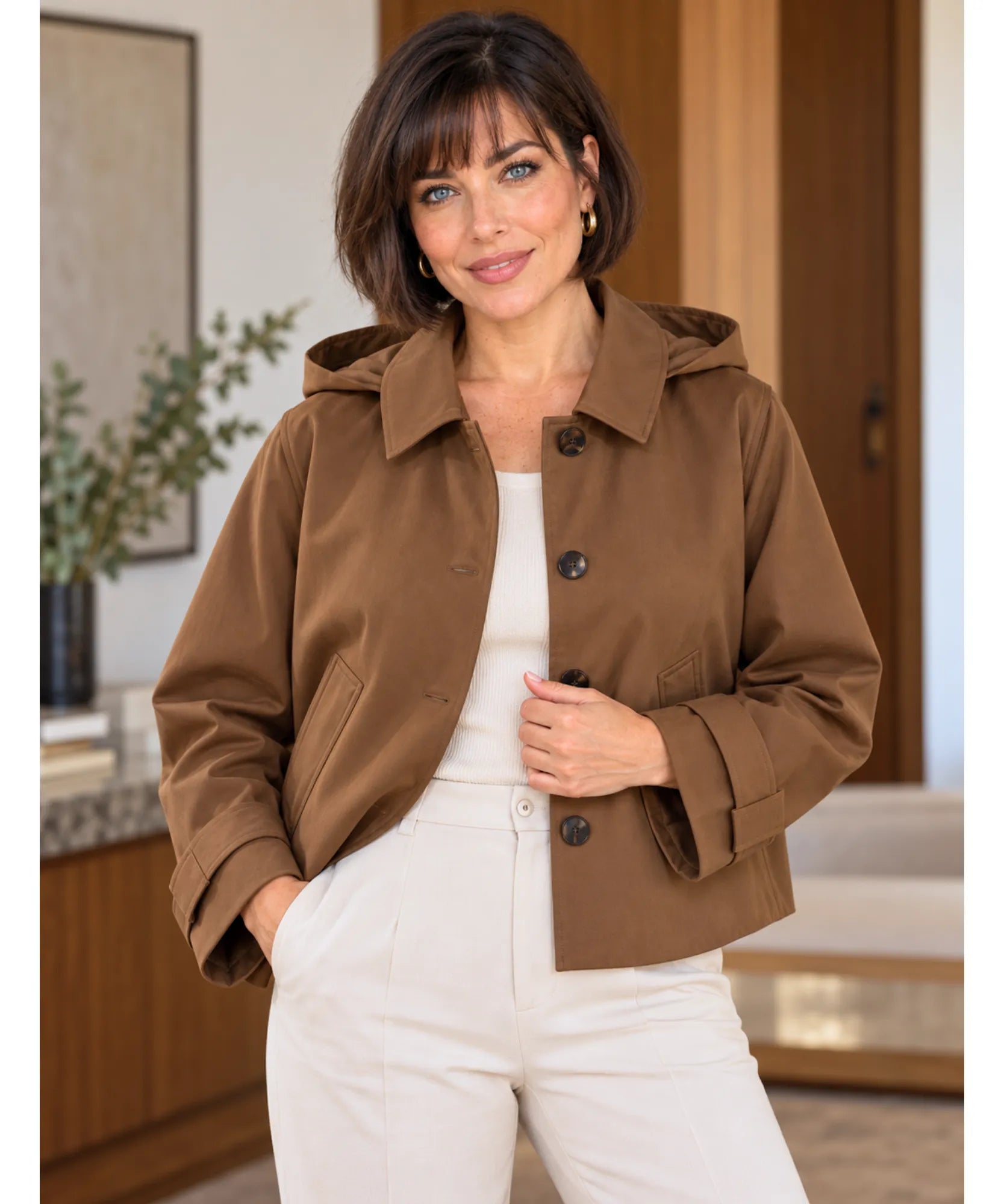 Women's utility jacket in brown worn open over a white top
