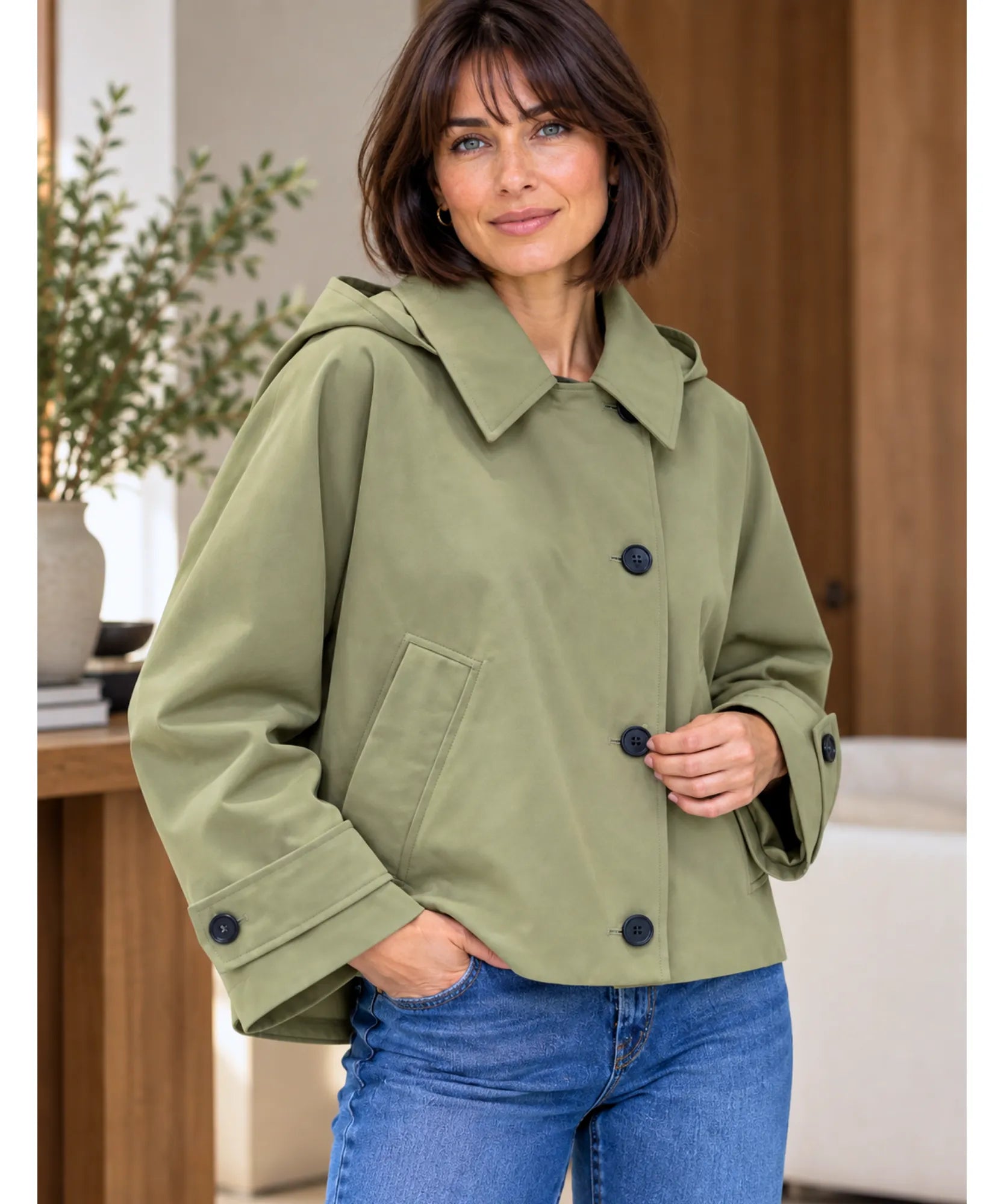 Women's utility jacket in olive green styled with jeans