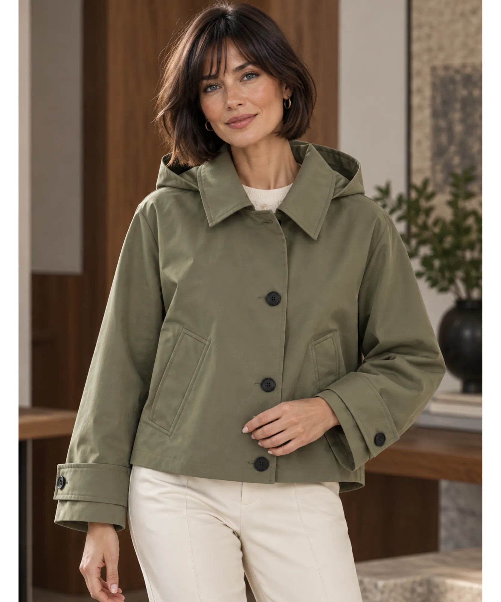 Women's utility jacket in olive green buttoned, front view