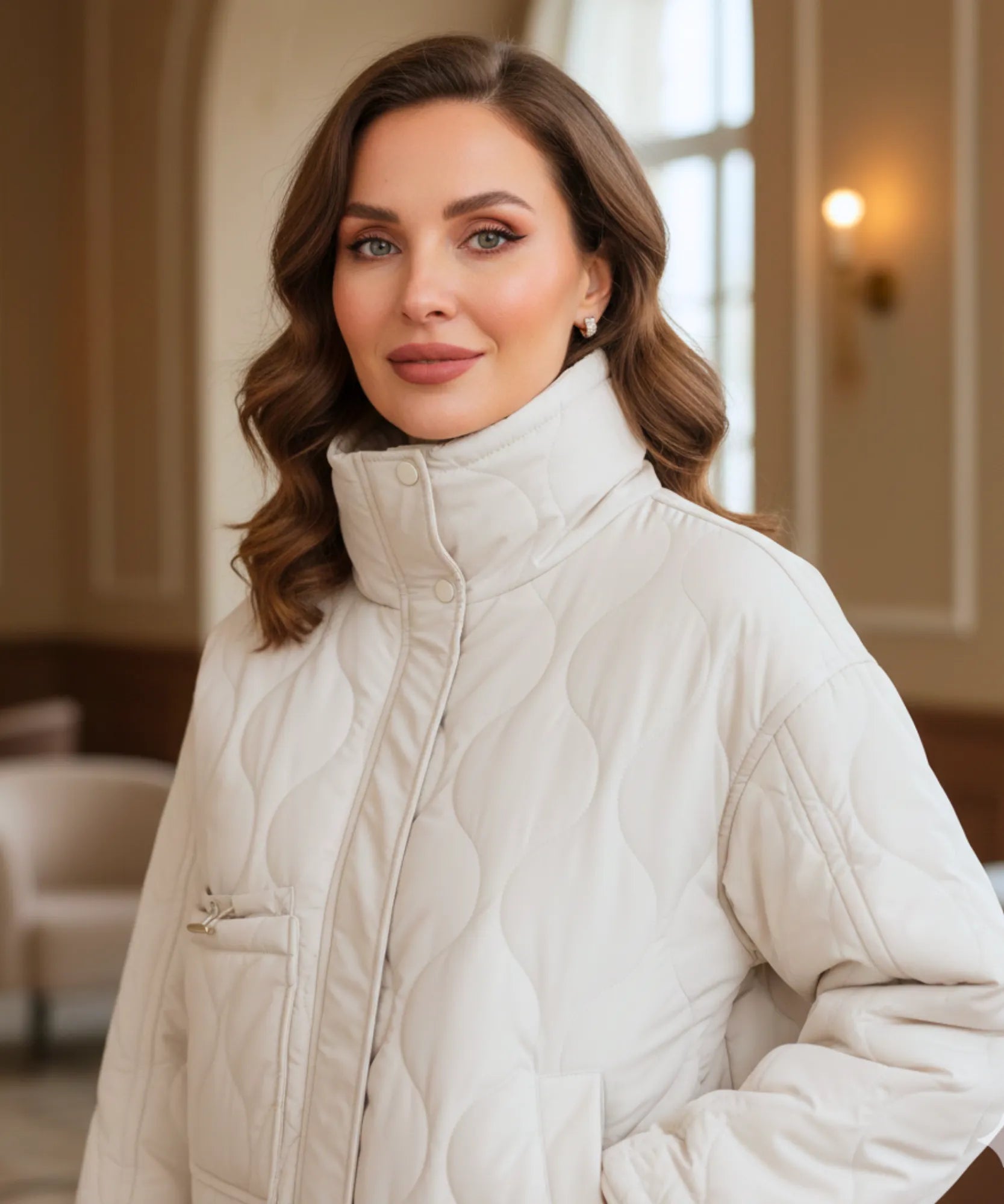 Women's oversized puffer jacket in white, back view