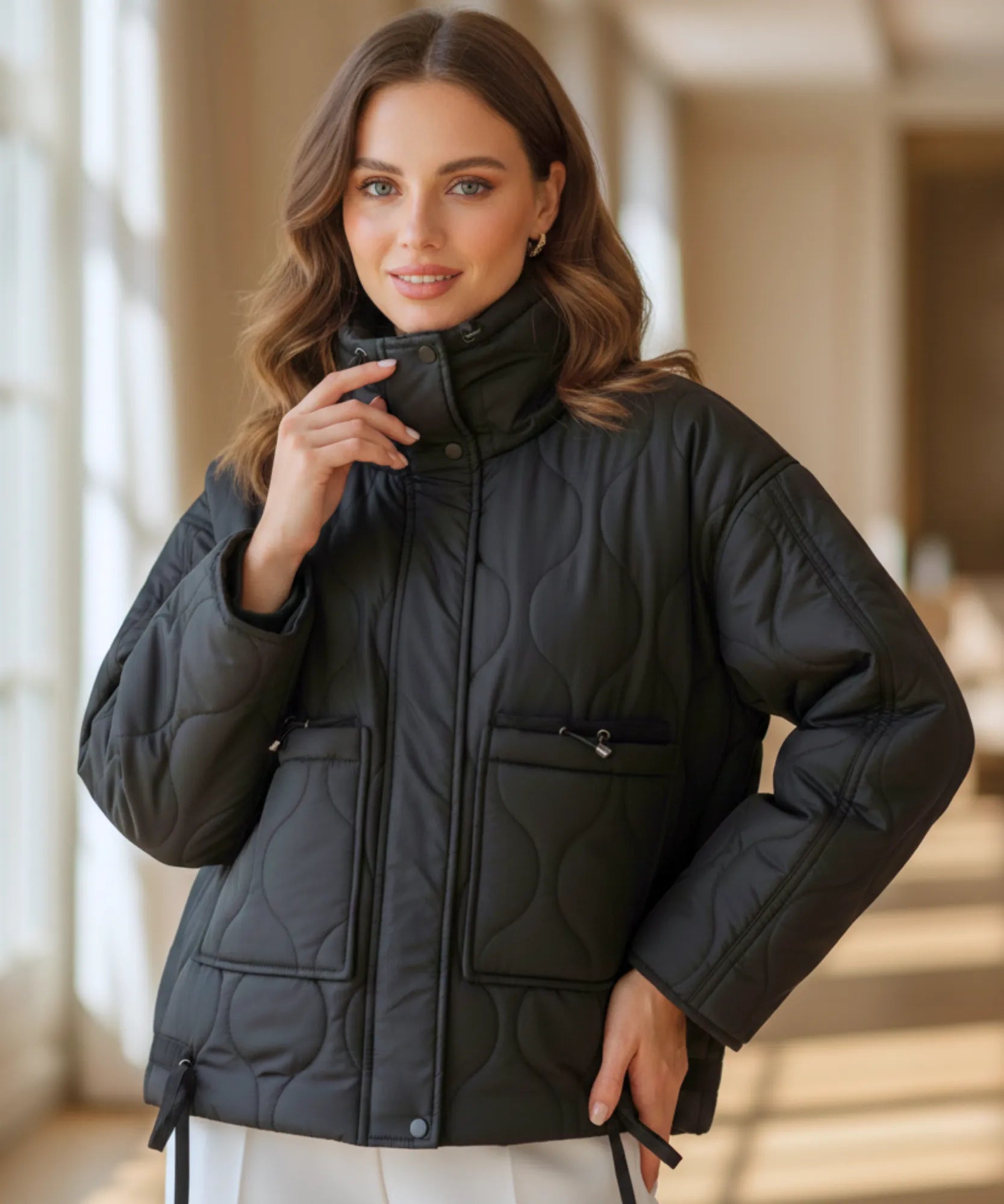 Women's oversized puffer jacket in black, front view
