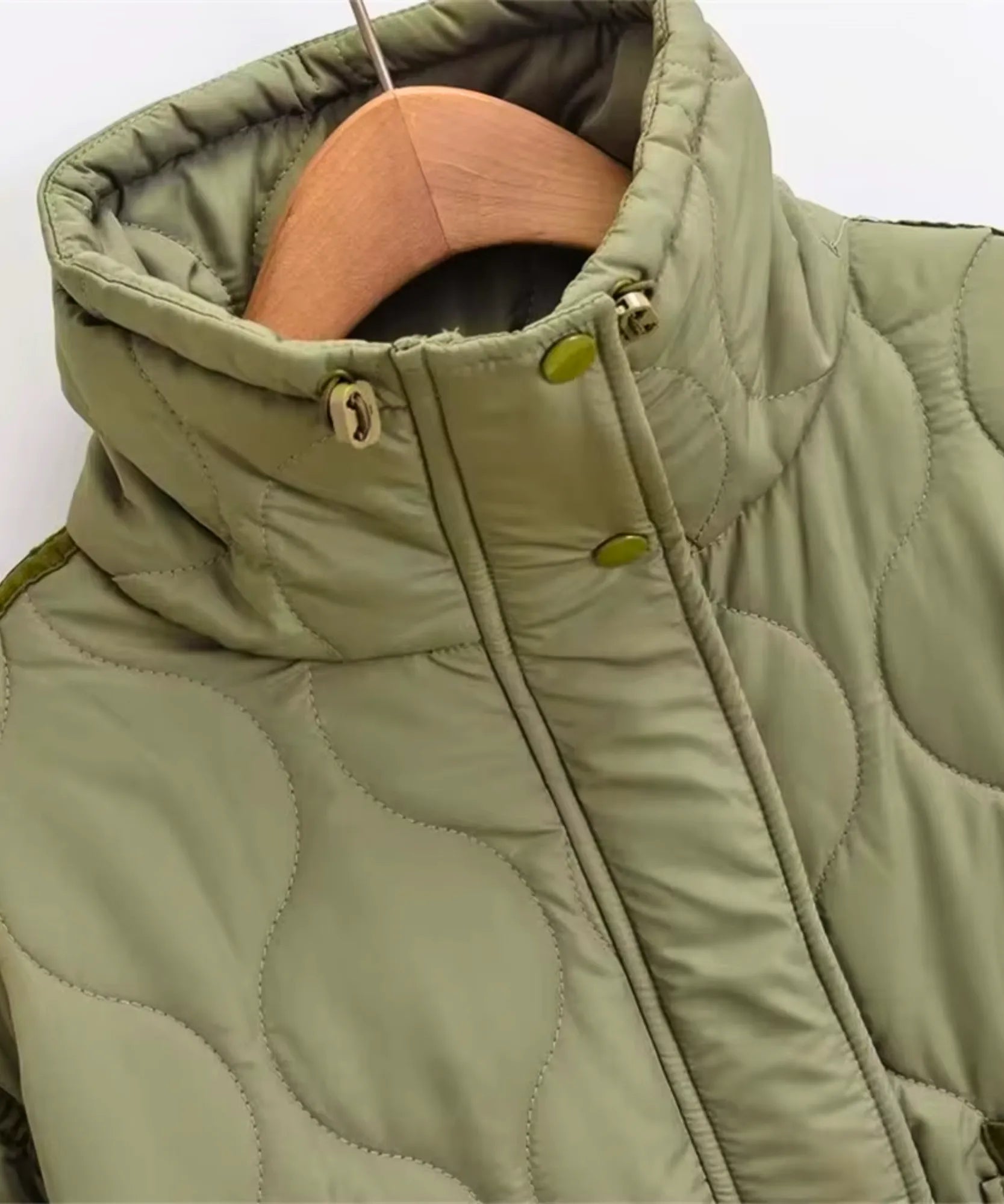Women's oversized puffer jacket in olive green, quilted detail