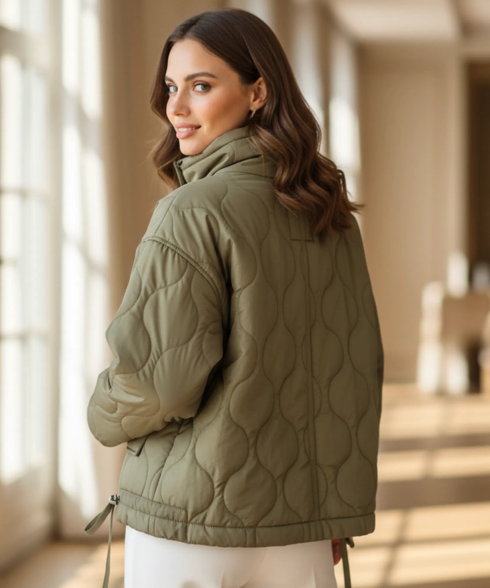 Women's oversized puffer jacket in olive green, detail view