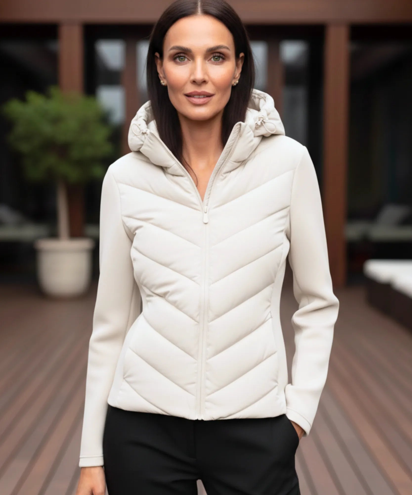 Women's waterproof puffer jacket in white, back view