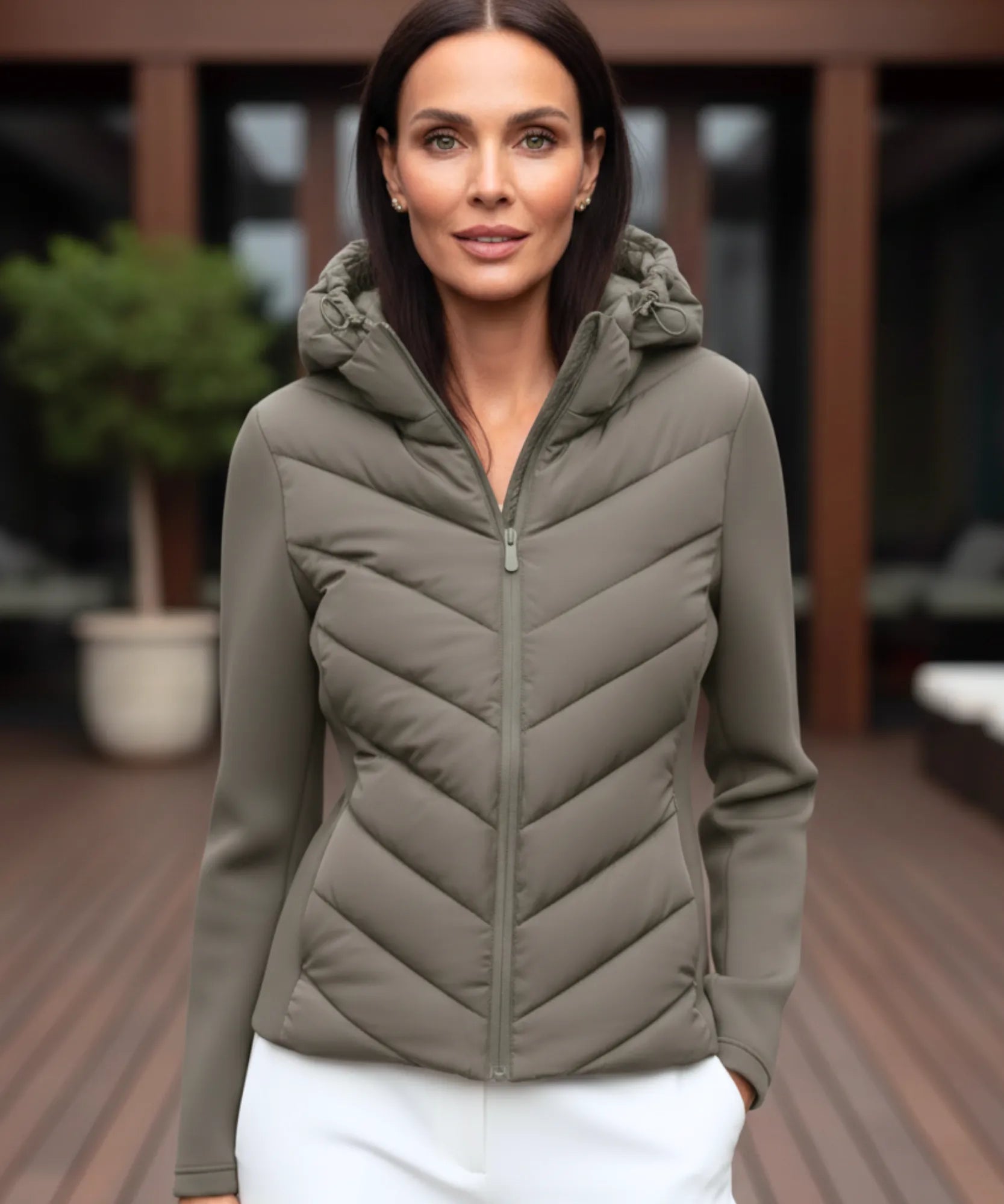 Women's waterproof puffer jacket in olive green, front view