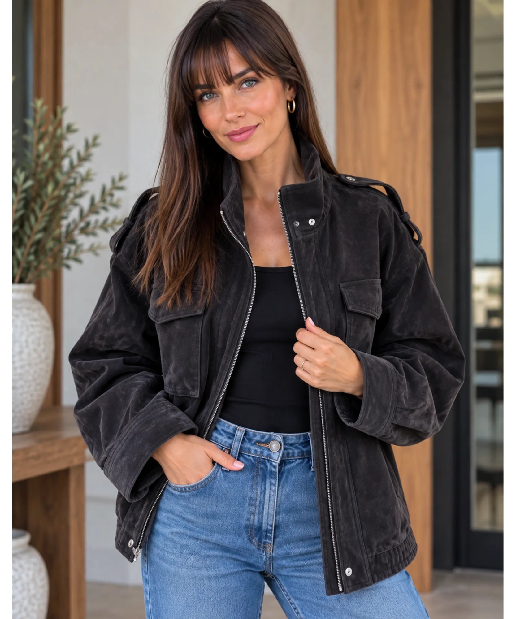 Women's suede bomber jacket in charcoal styled with jeans