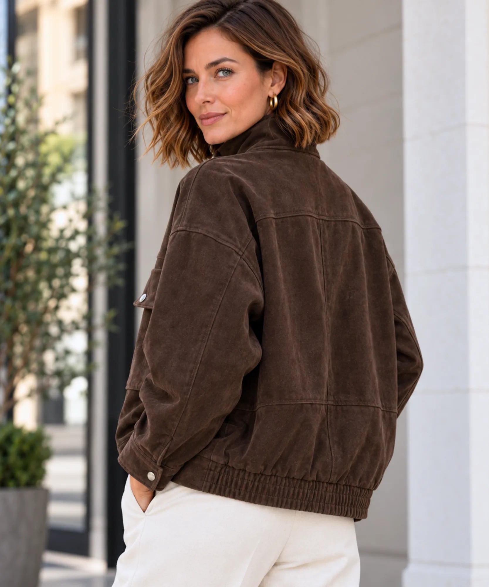 Women's brown suede jacket, relaxed fit seen from the back