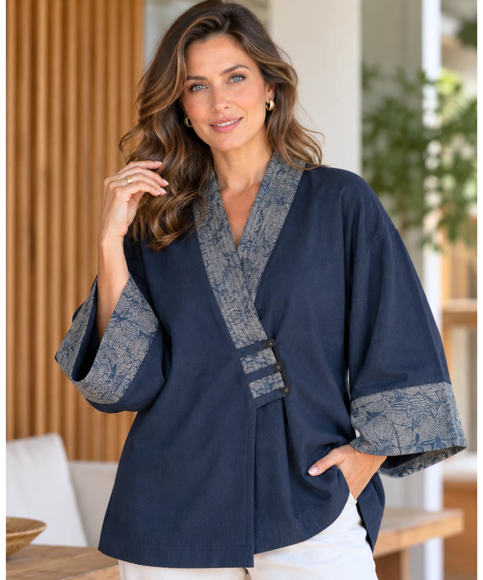 Women's navy denim kimono jacket with wide sleeves and floral jacquard trim