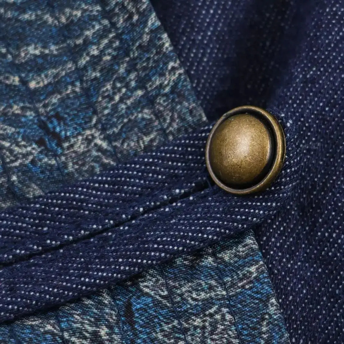 Close-up of denim texture on a women's navy kimono jacket