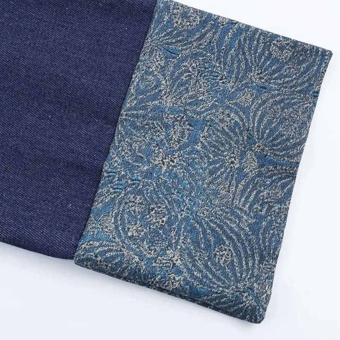 Close-up of floral jacquard cuff on a women's denim kimono jacket