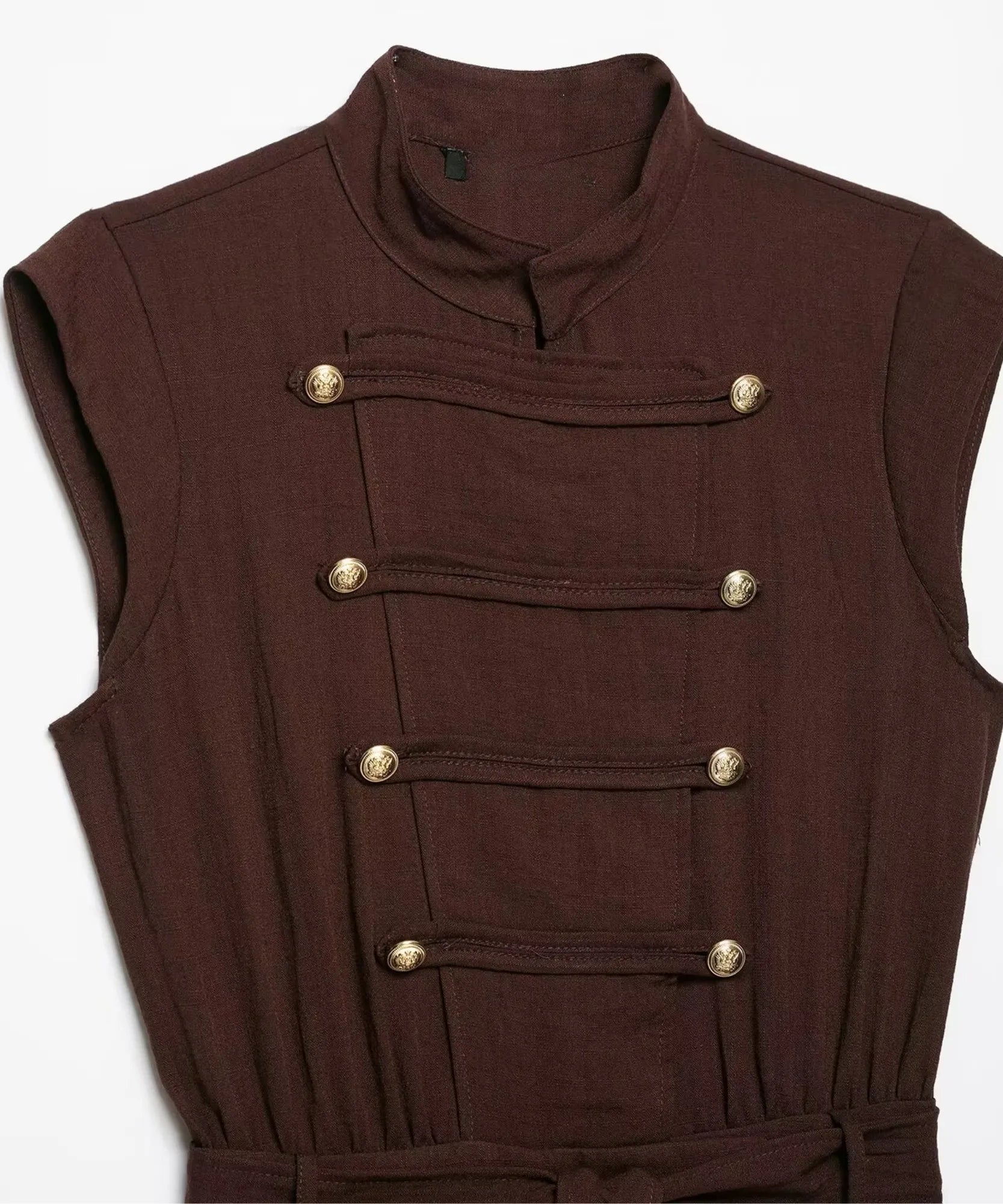 Women's brown jumpsuit bodice with double-row gold buttons, flat lay