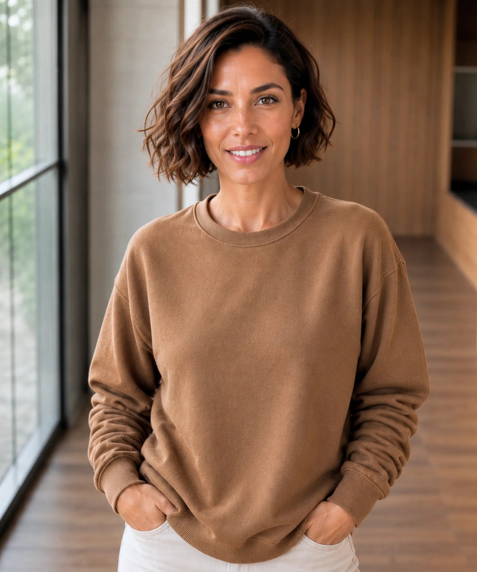 Women's camel fleece lined crew neck sweatshirt with hands in pockets