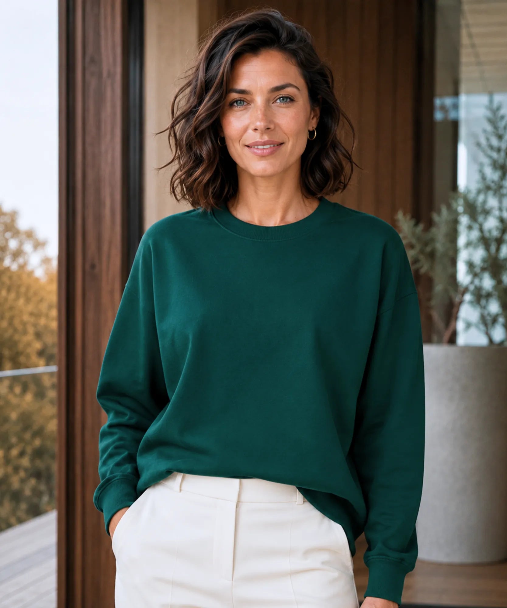 Women's forest green fleece lined crew neck sweatshirt, front view