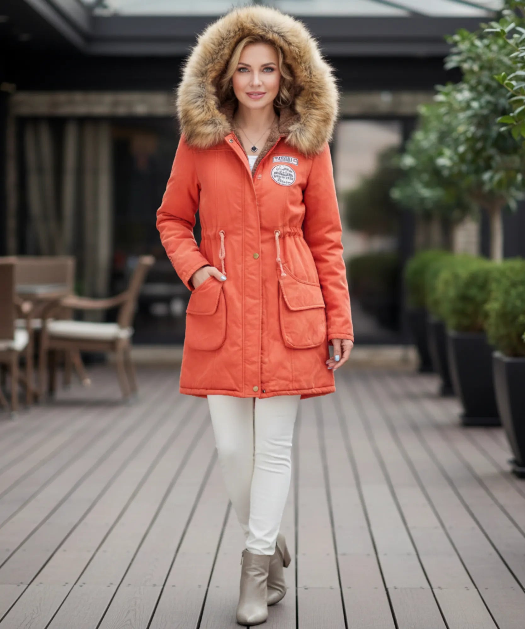 Women's fur hood parka in orange, side view