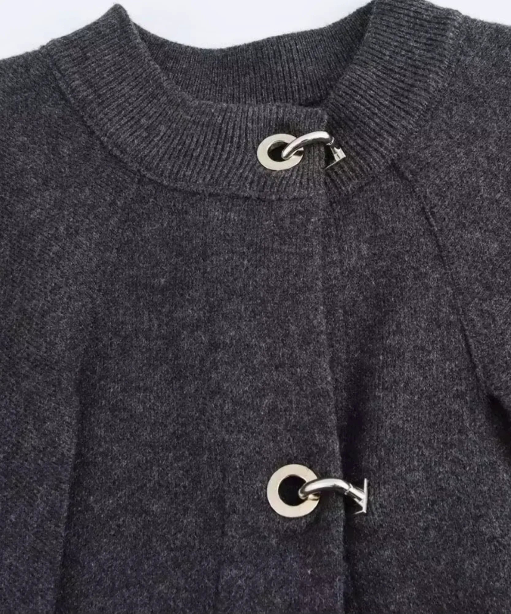 Women's charcoal knit poncho with toggle clasps, fabric detail